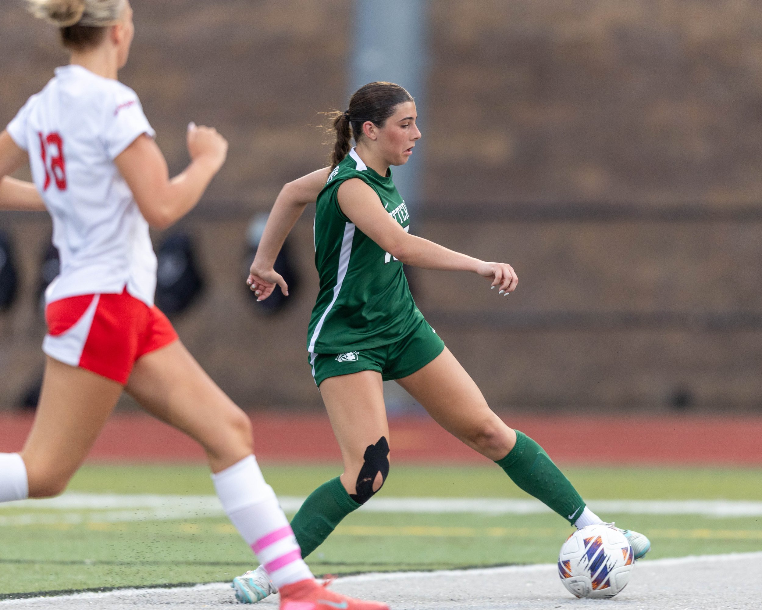 #15 with the ball at the goal