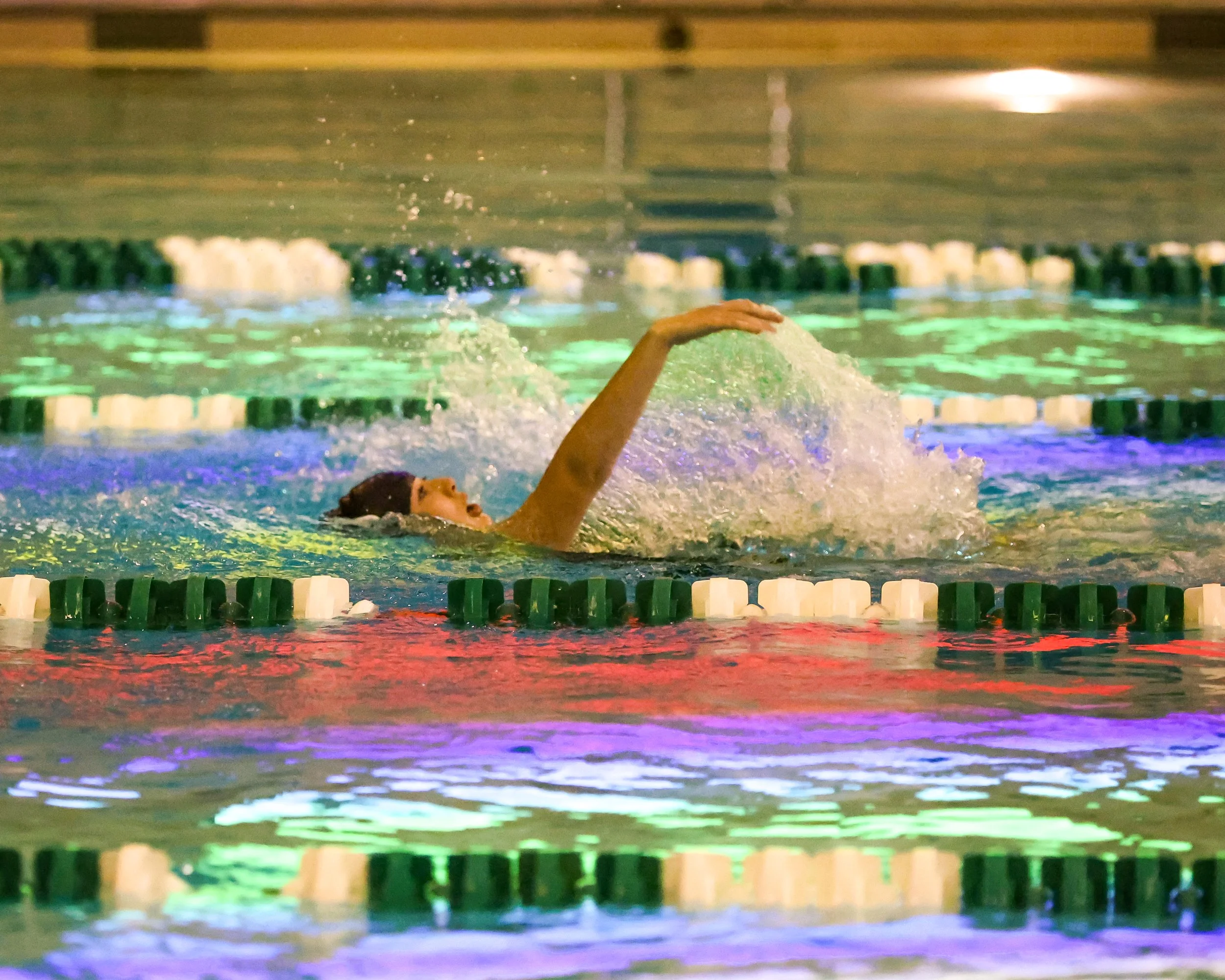WU swimmer doing the backstroke