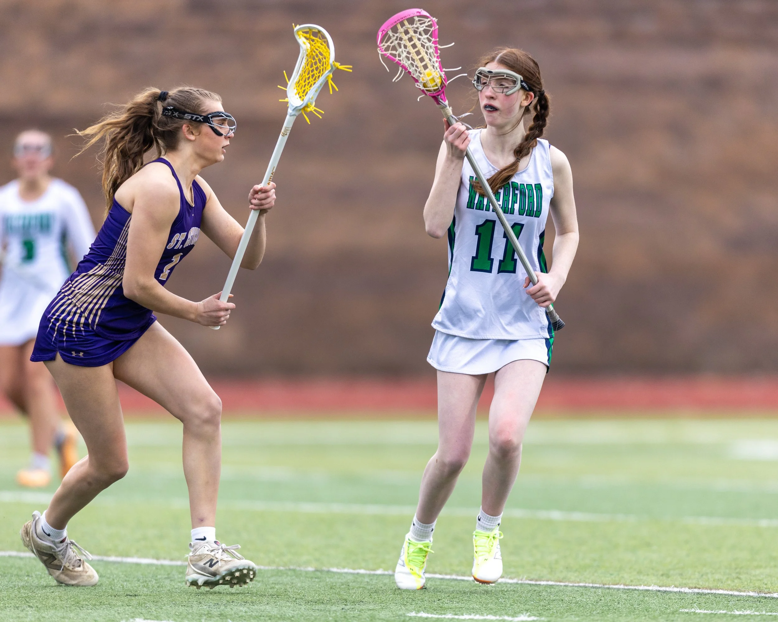 #11 carries the ball guarded by SC #2