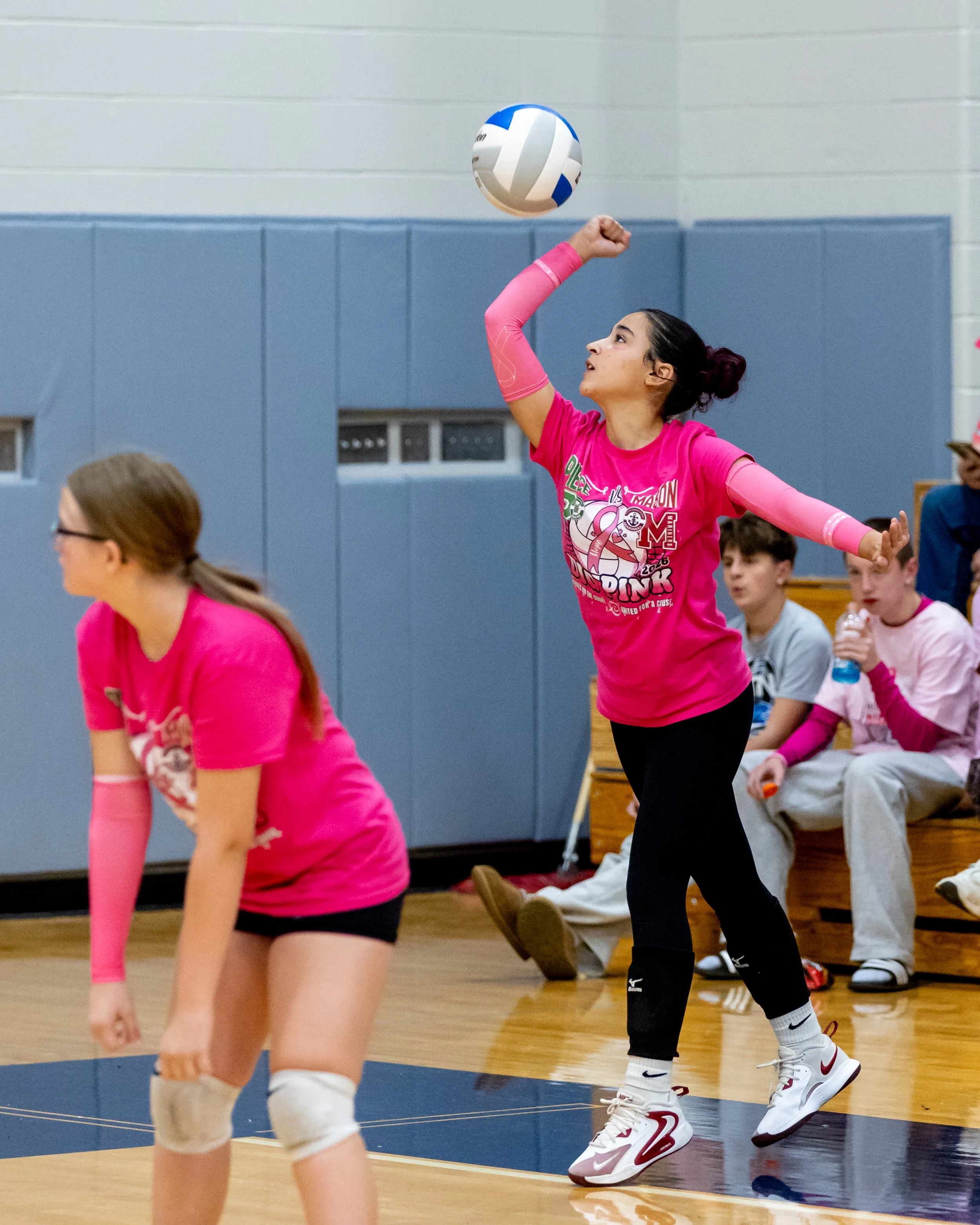 Pierce player serves the ball