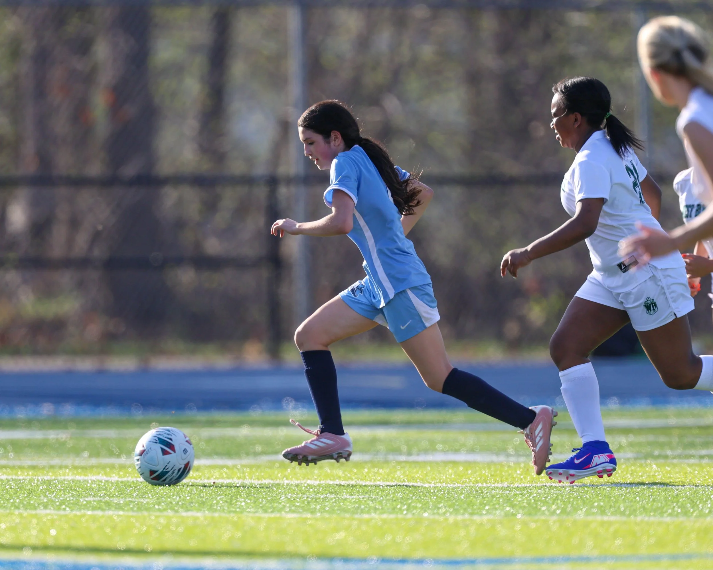 #8 drives the ball down the pitch