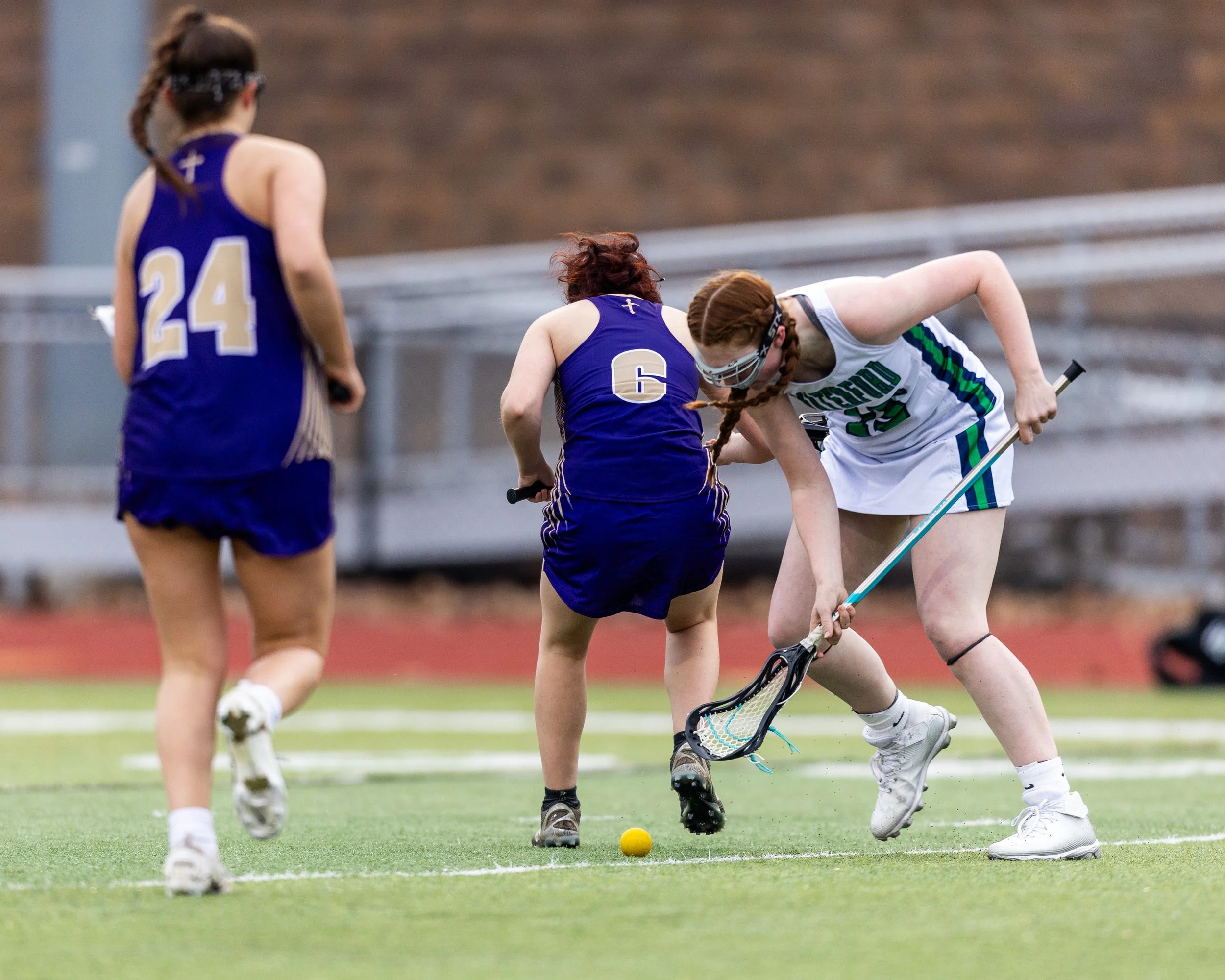 #15 fights for the ball