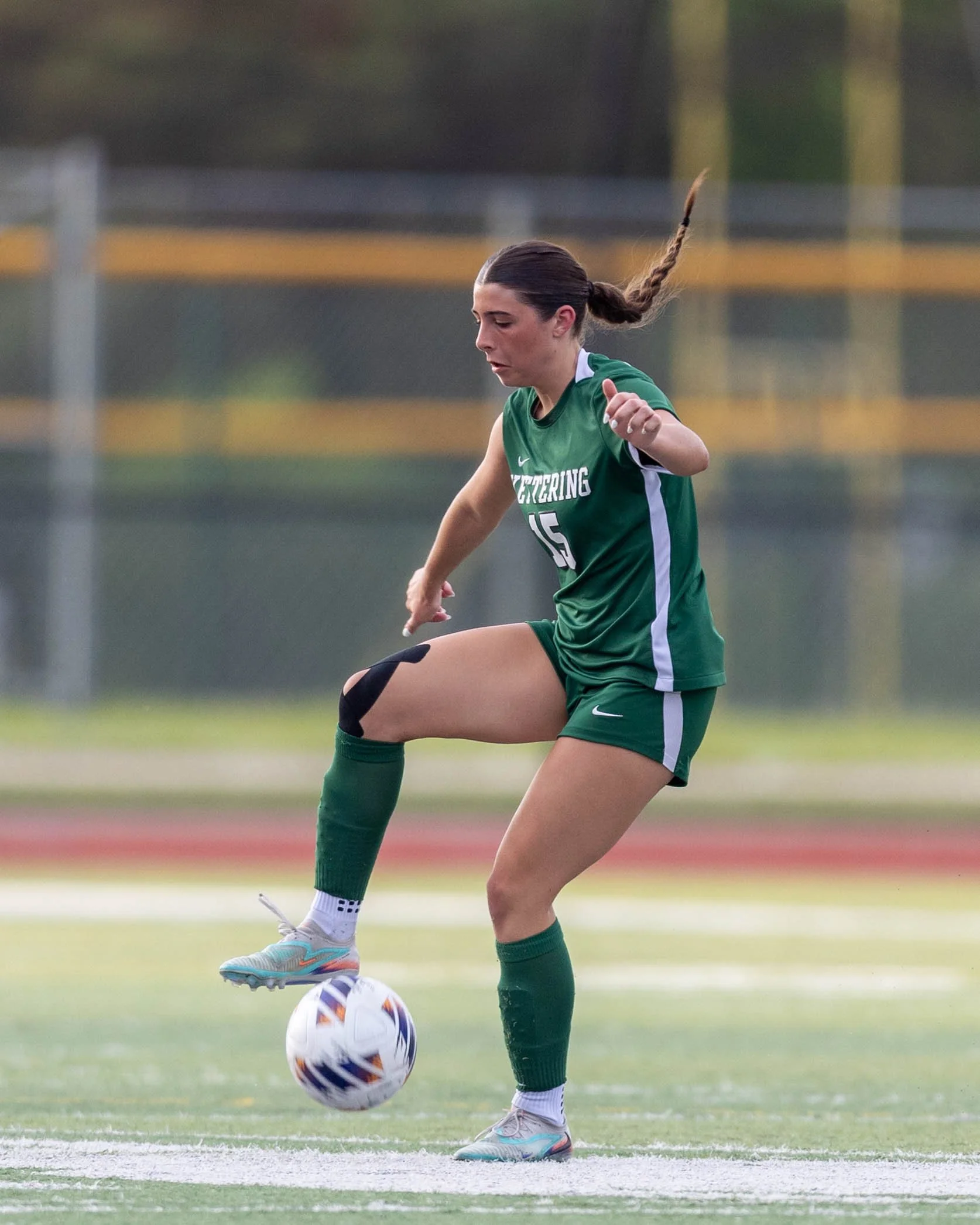#15 stops the ball her foot