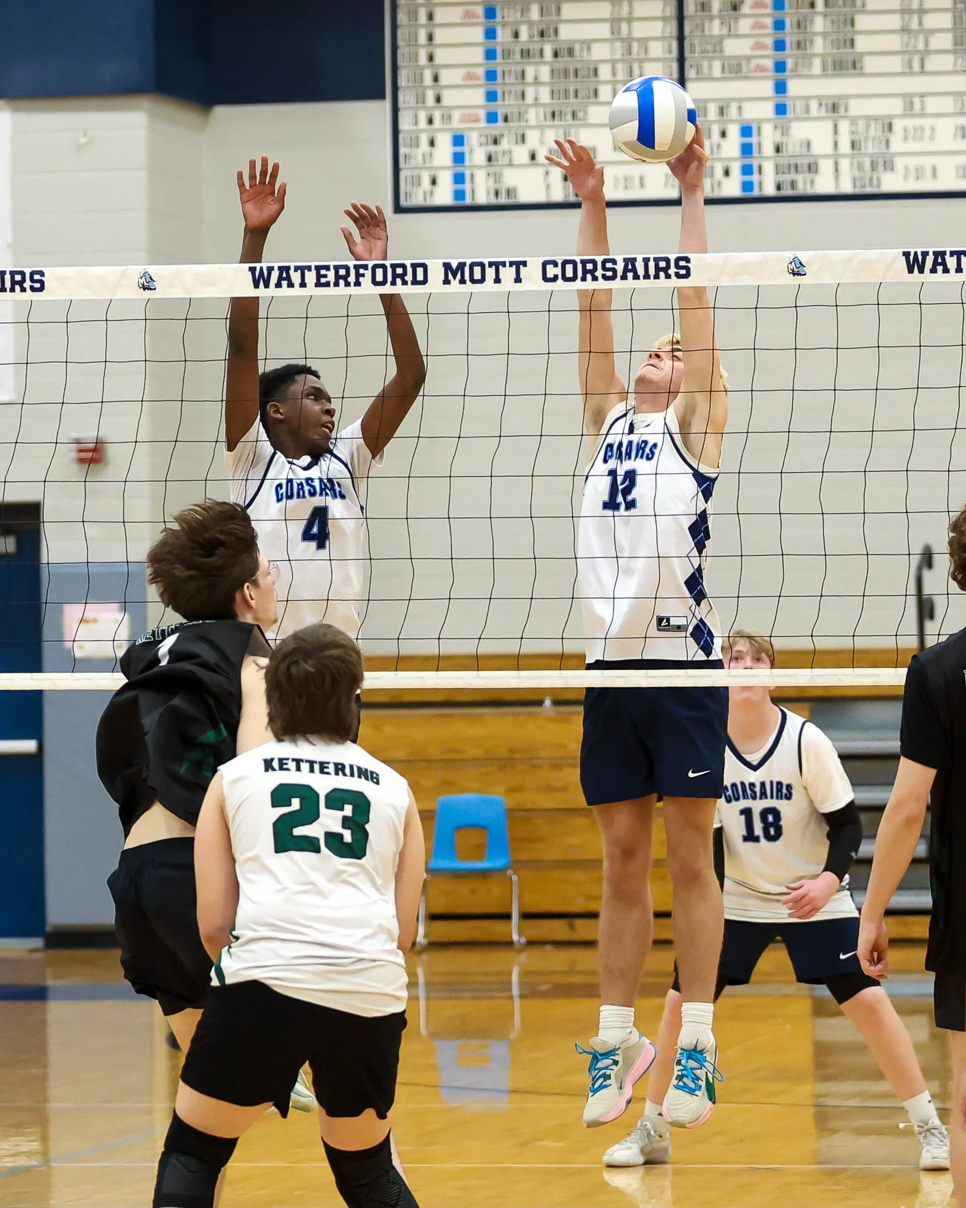 Mott #18 blocks the ball