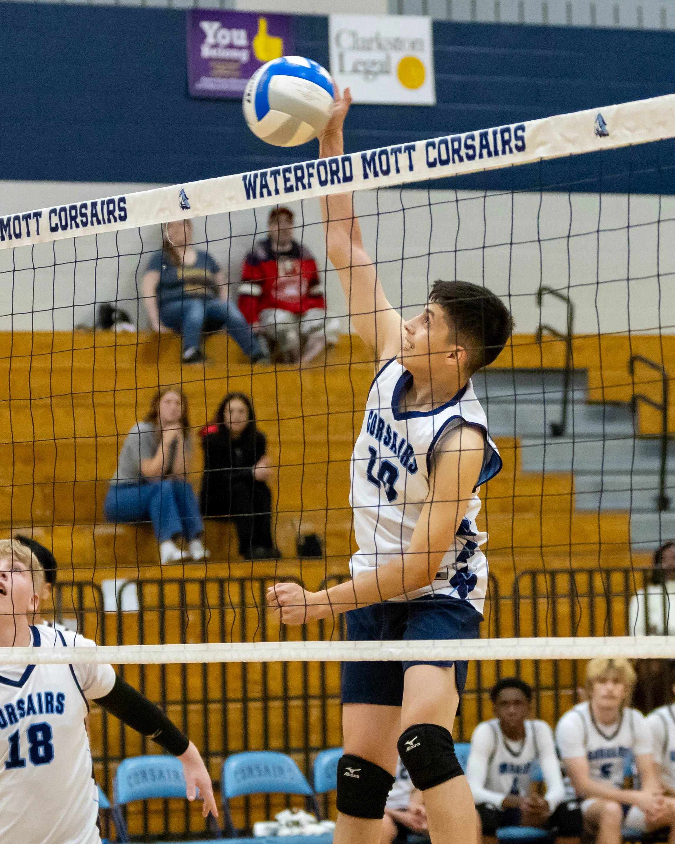 #10 spikes the ball