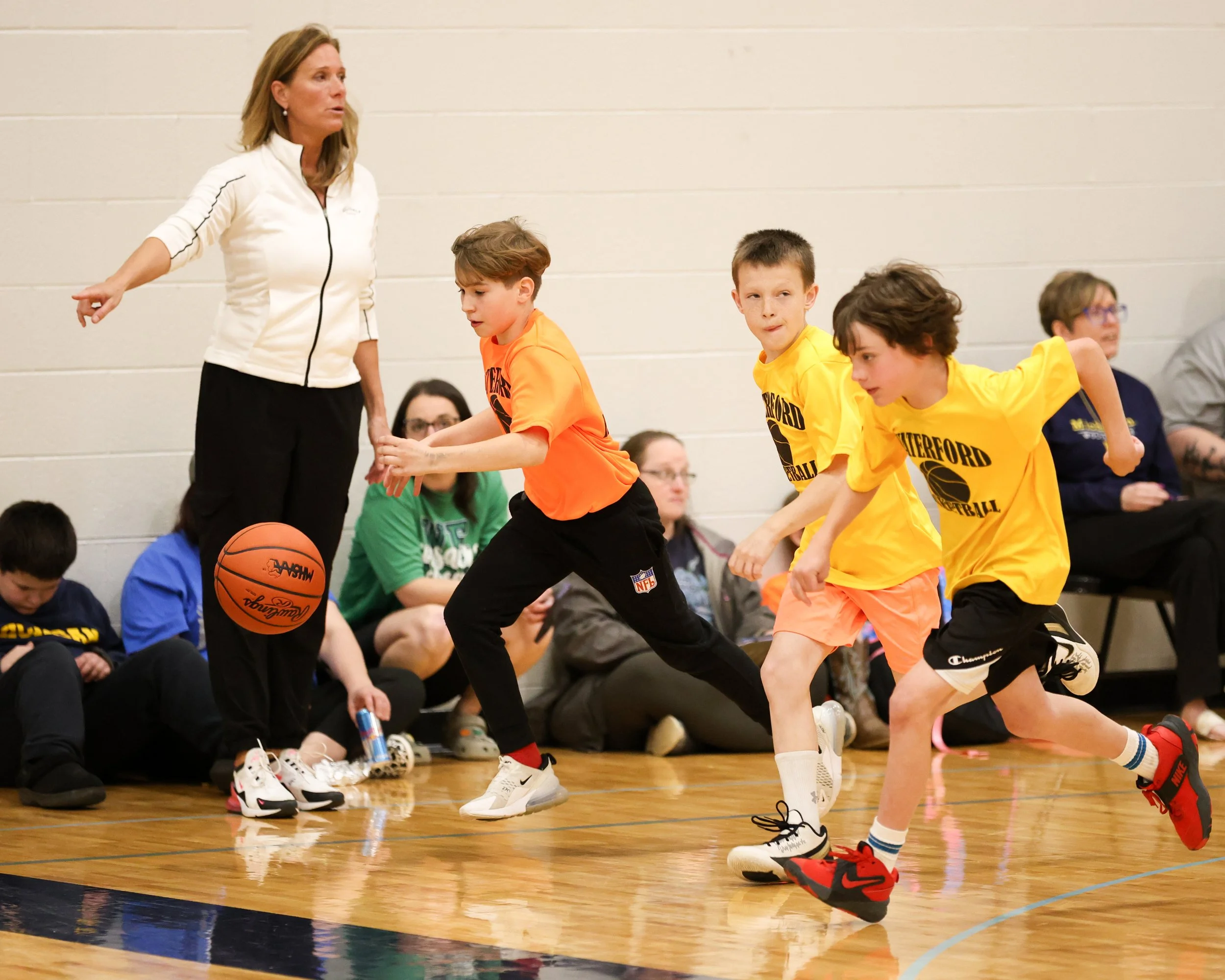 Knudsen boy dribbling the past Schoolcraft boys