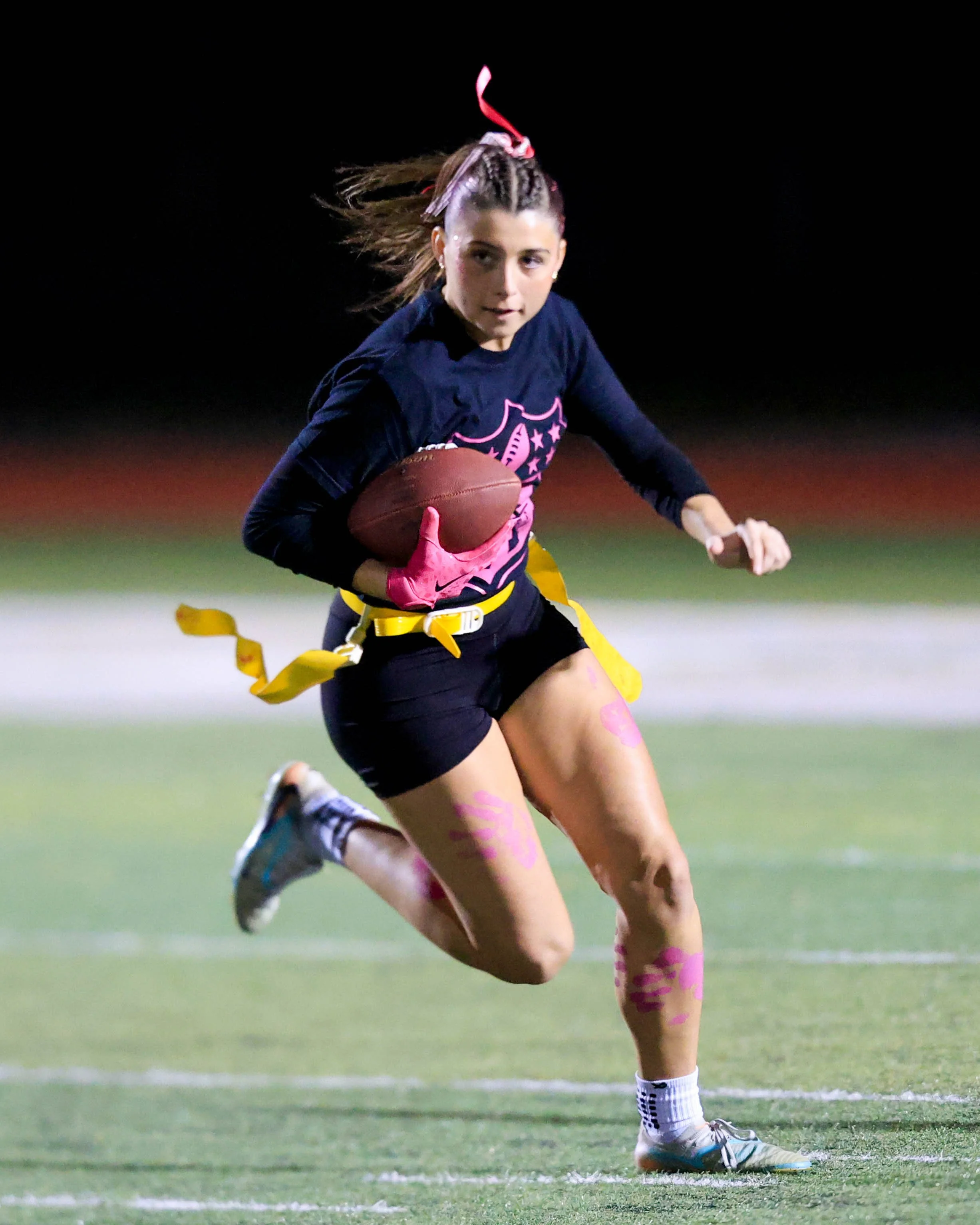Senior running with the ball