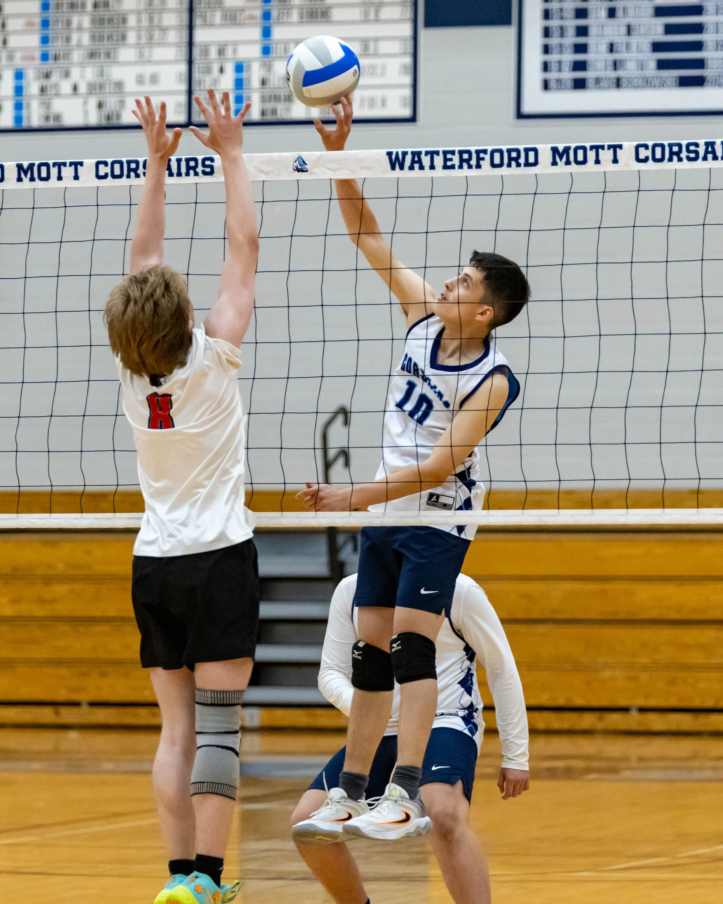 #10 spikes the ball