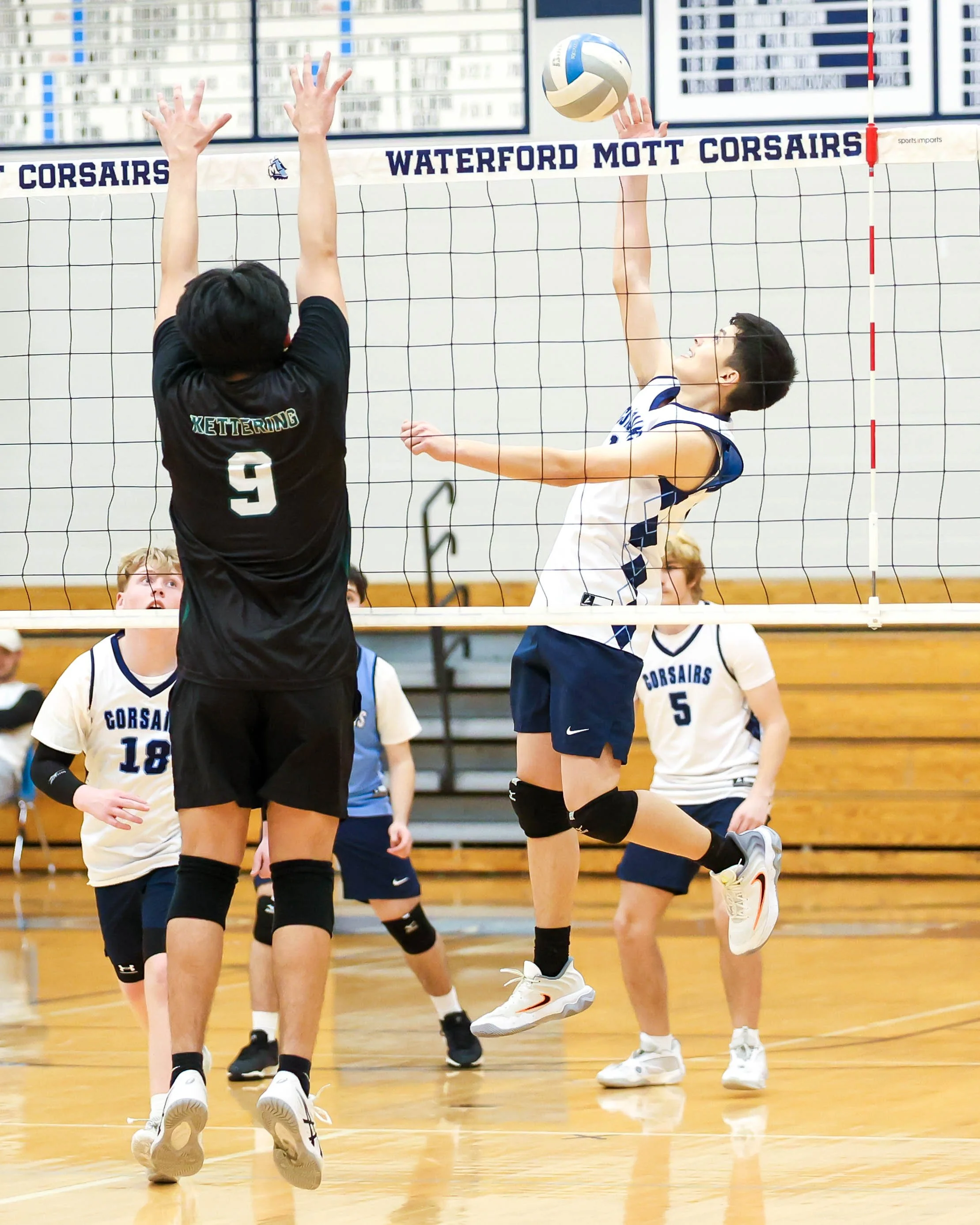 Mott #10 spikes the ball