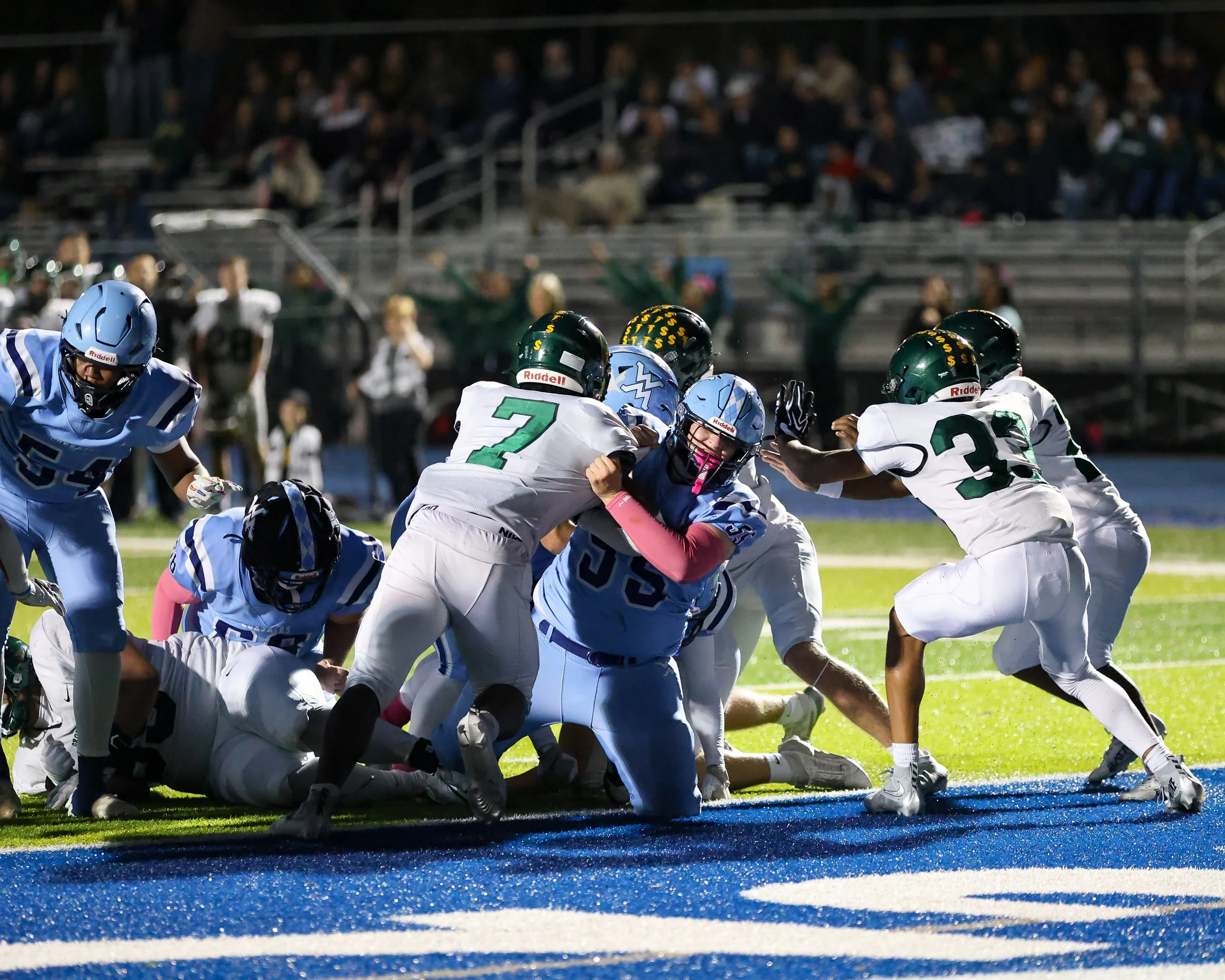Mott #55 blocks for the runner