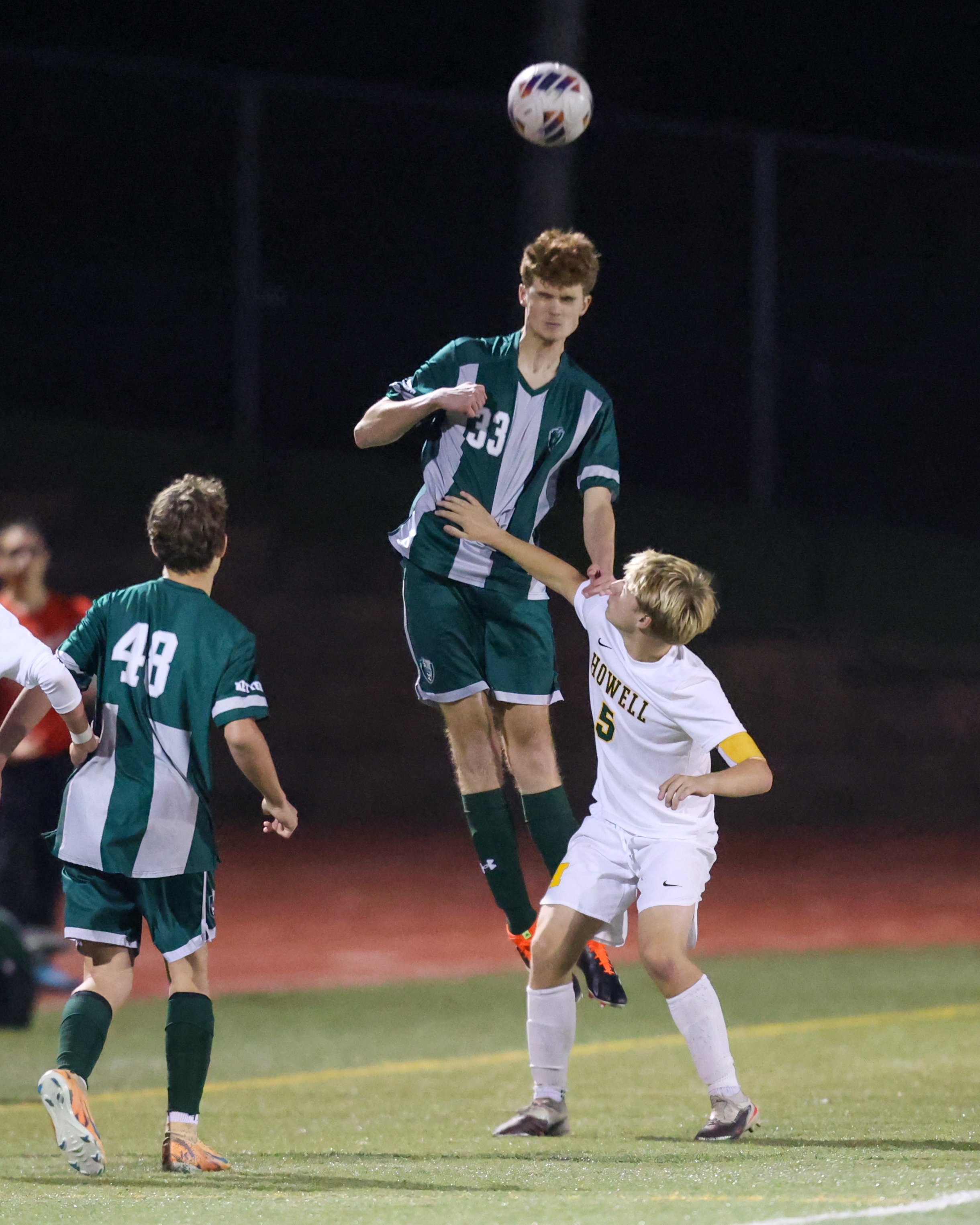 WK #33 heads the ball