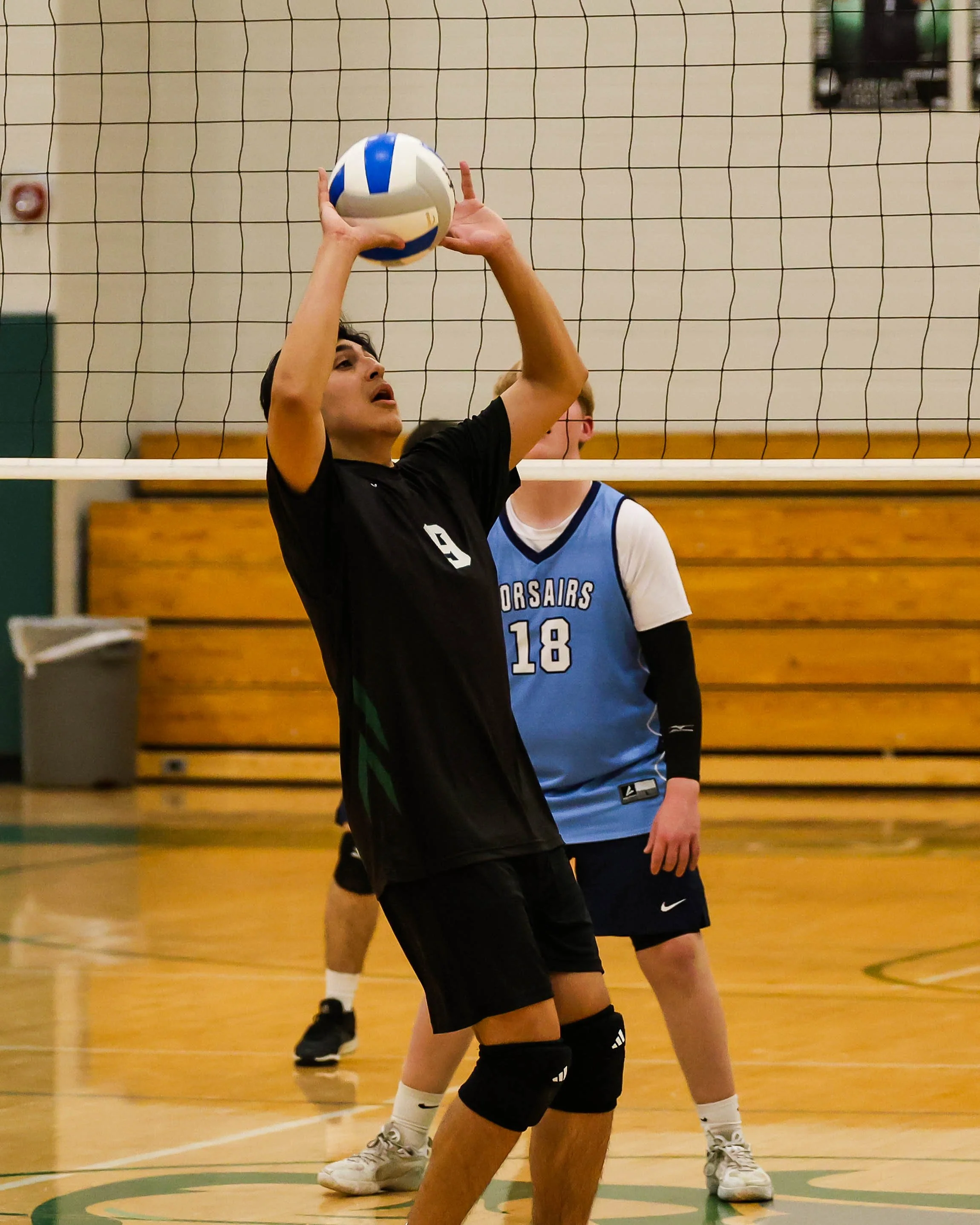 Kettering #9 sets the ball