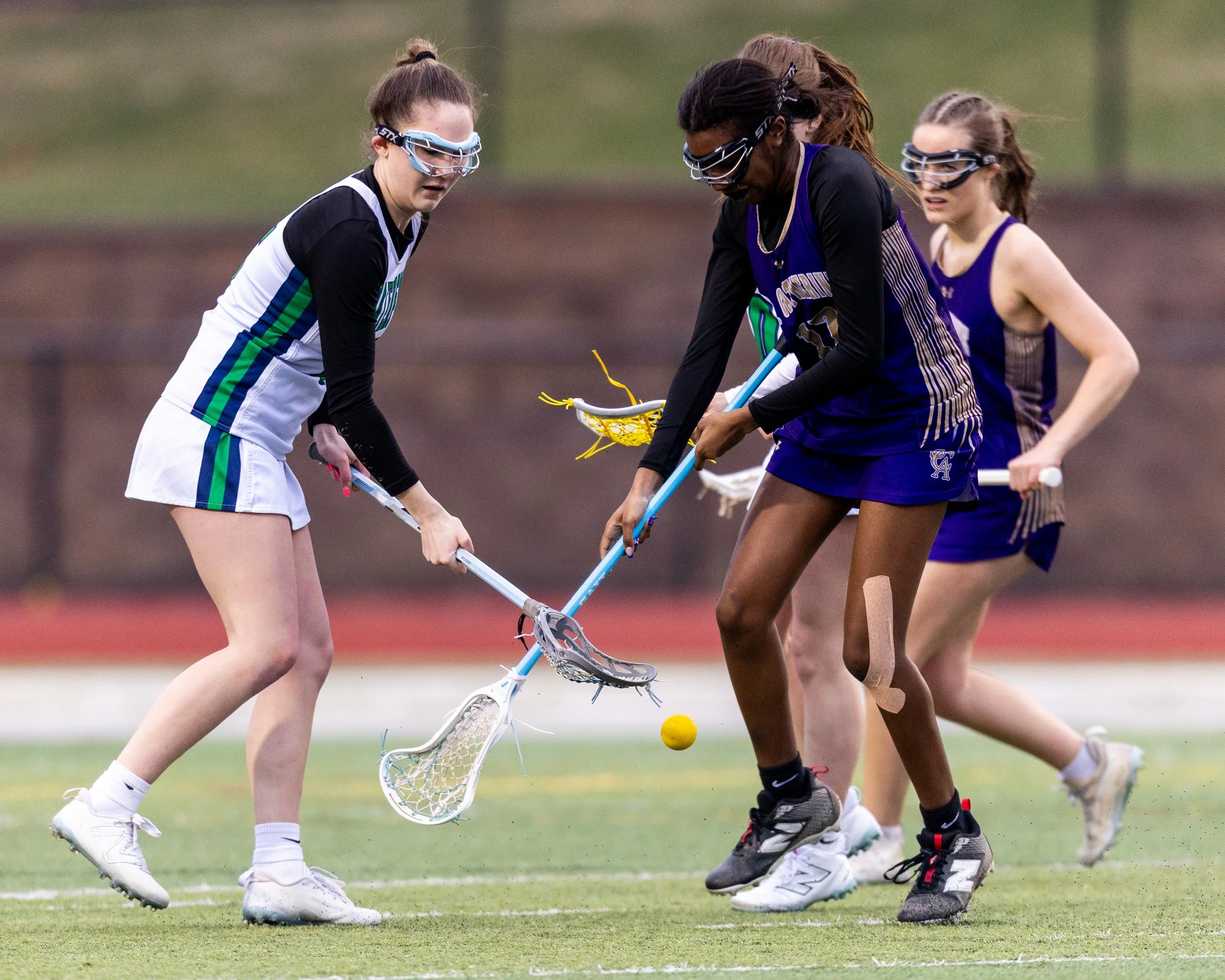 #5 fights from the ball with a St. Catherine player