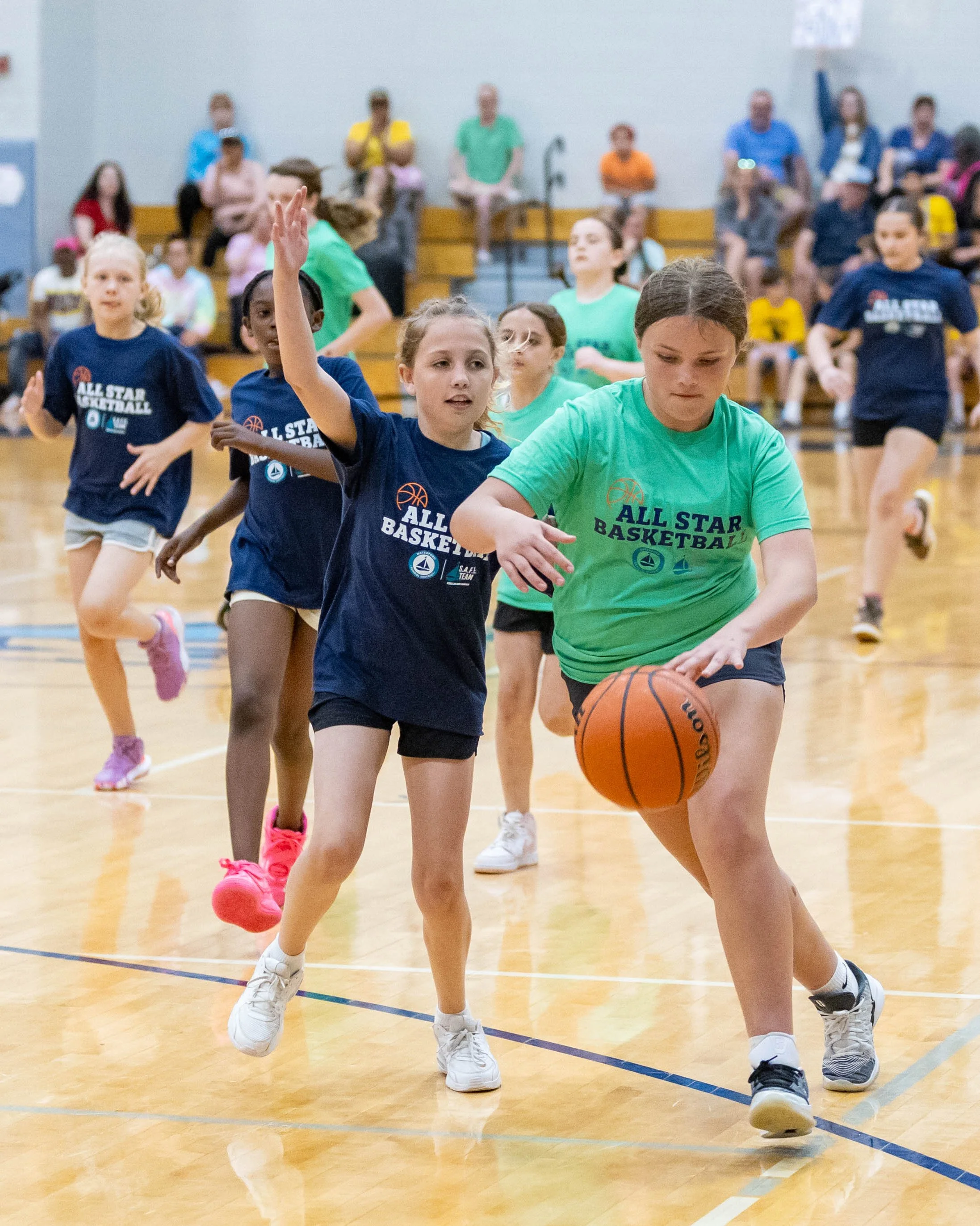 South girls drives past a defender