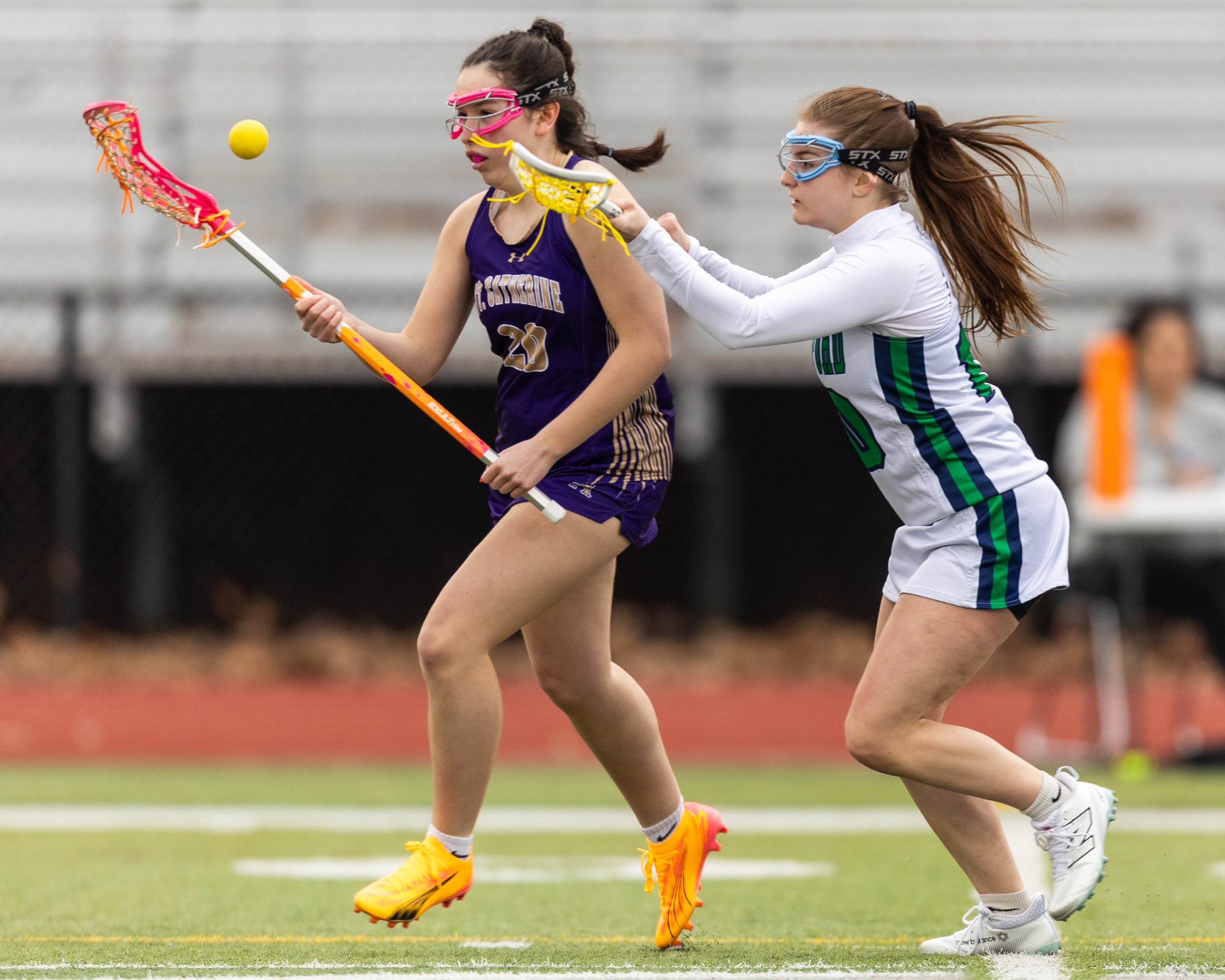 #10 pressures a St. Catherine's ball carrier 