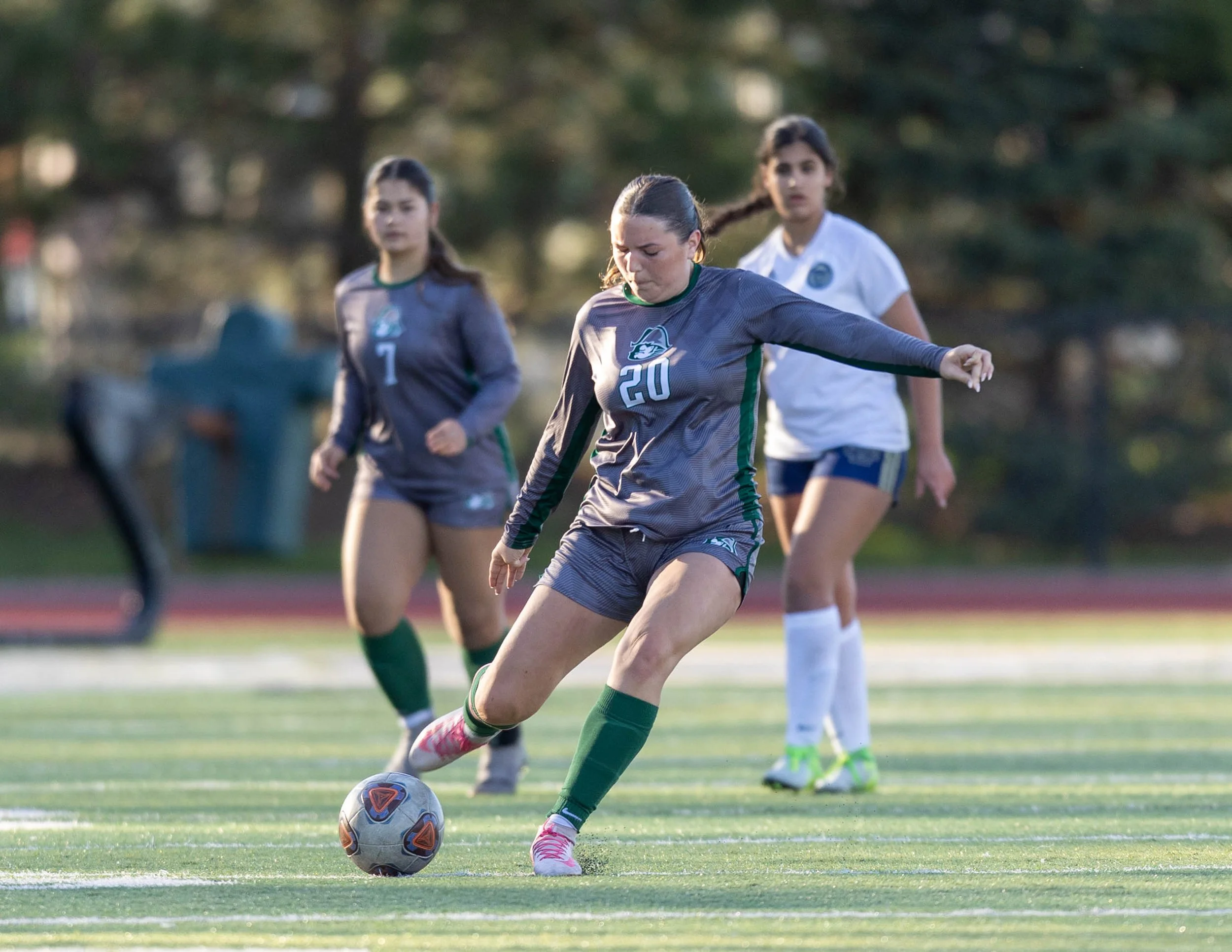 #20 kicks the ball