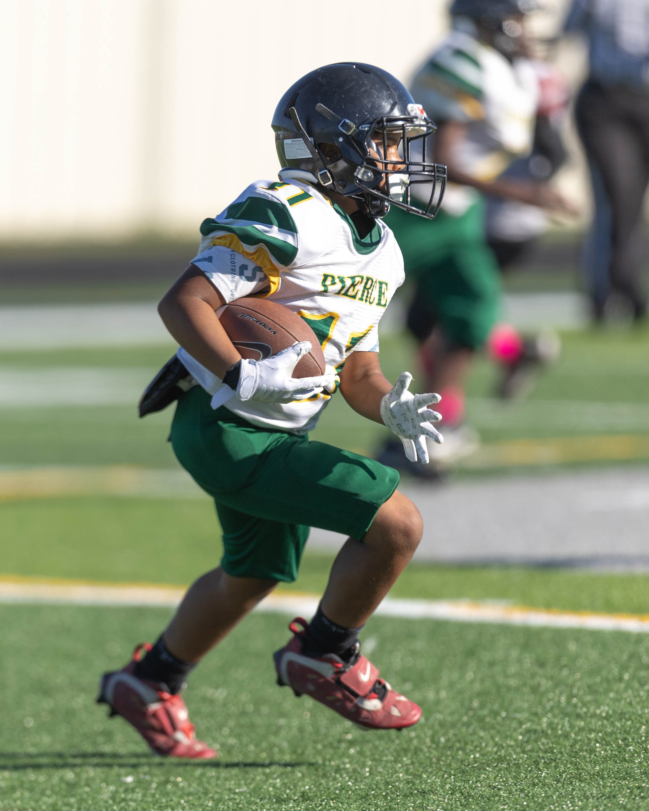 Pierce #11 runs with the ball
