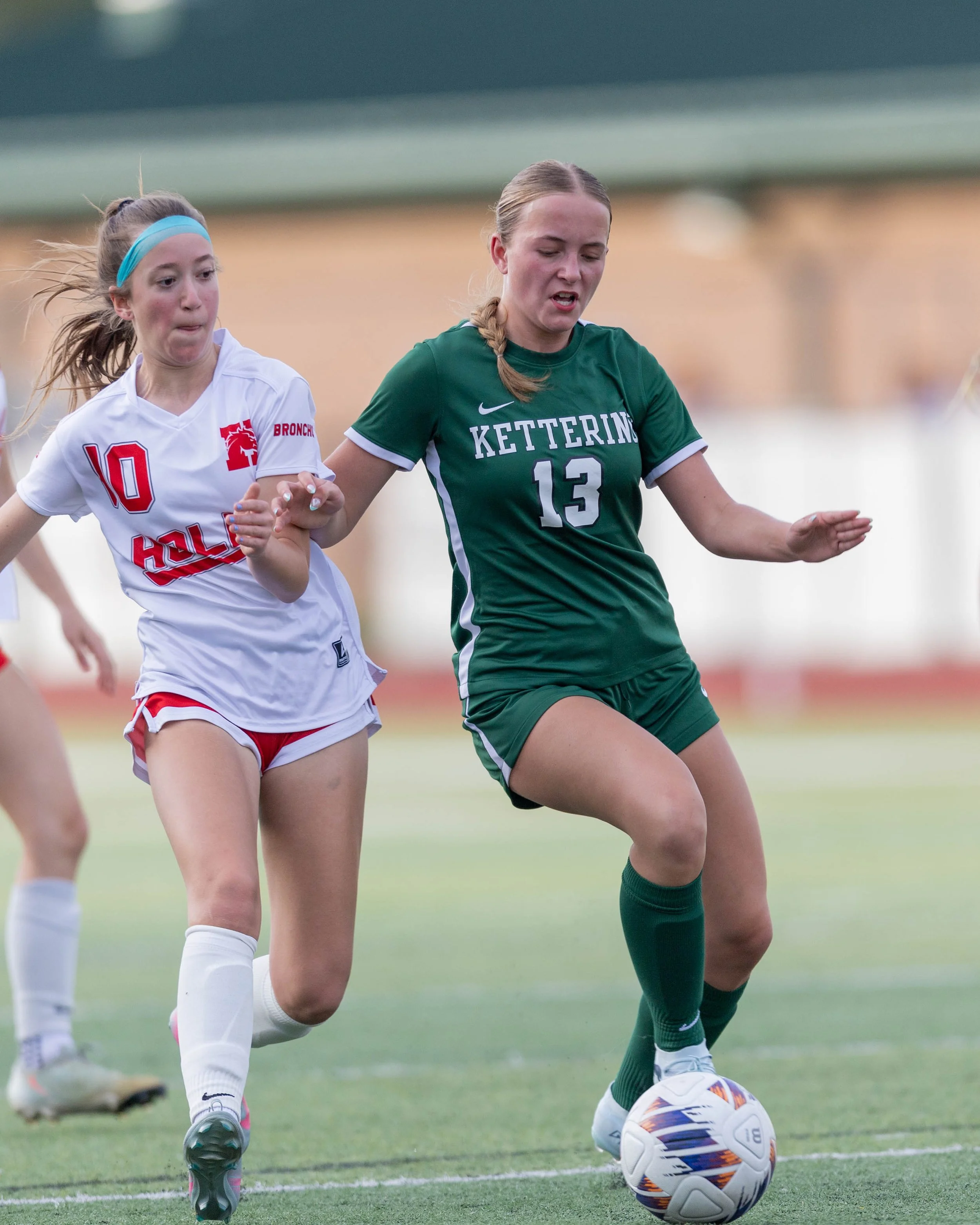#13 kicks the ball