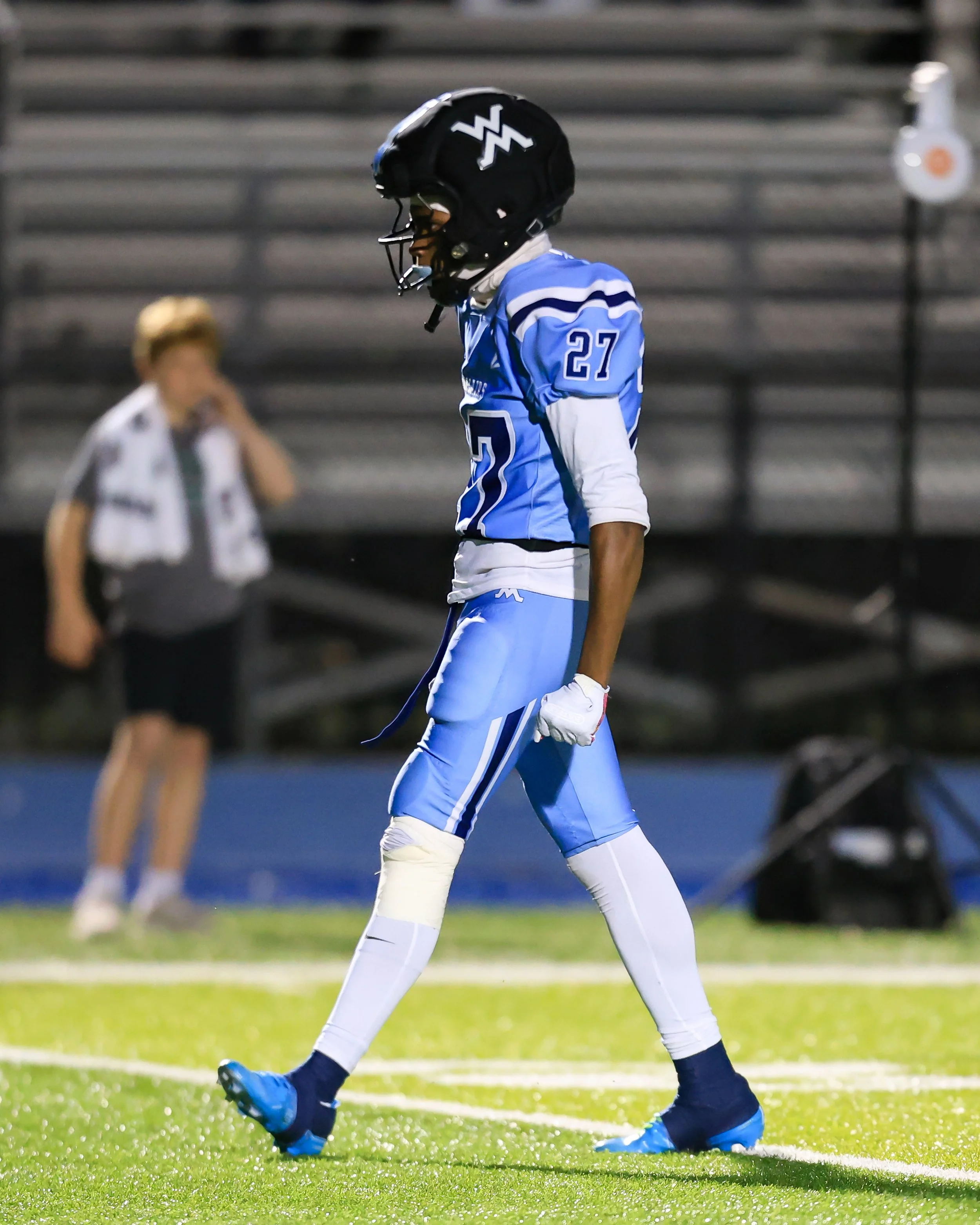 Mott #27 celebrates the tackle