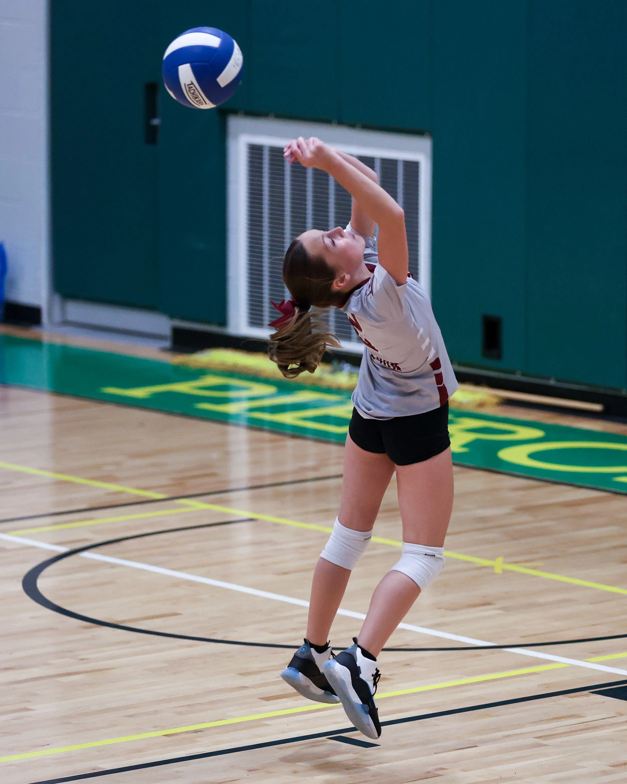 Mason girl returns the ball