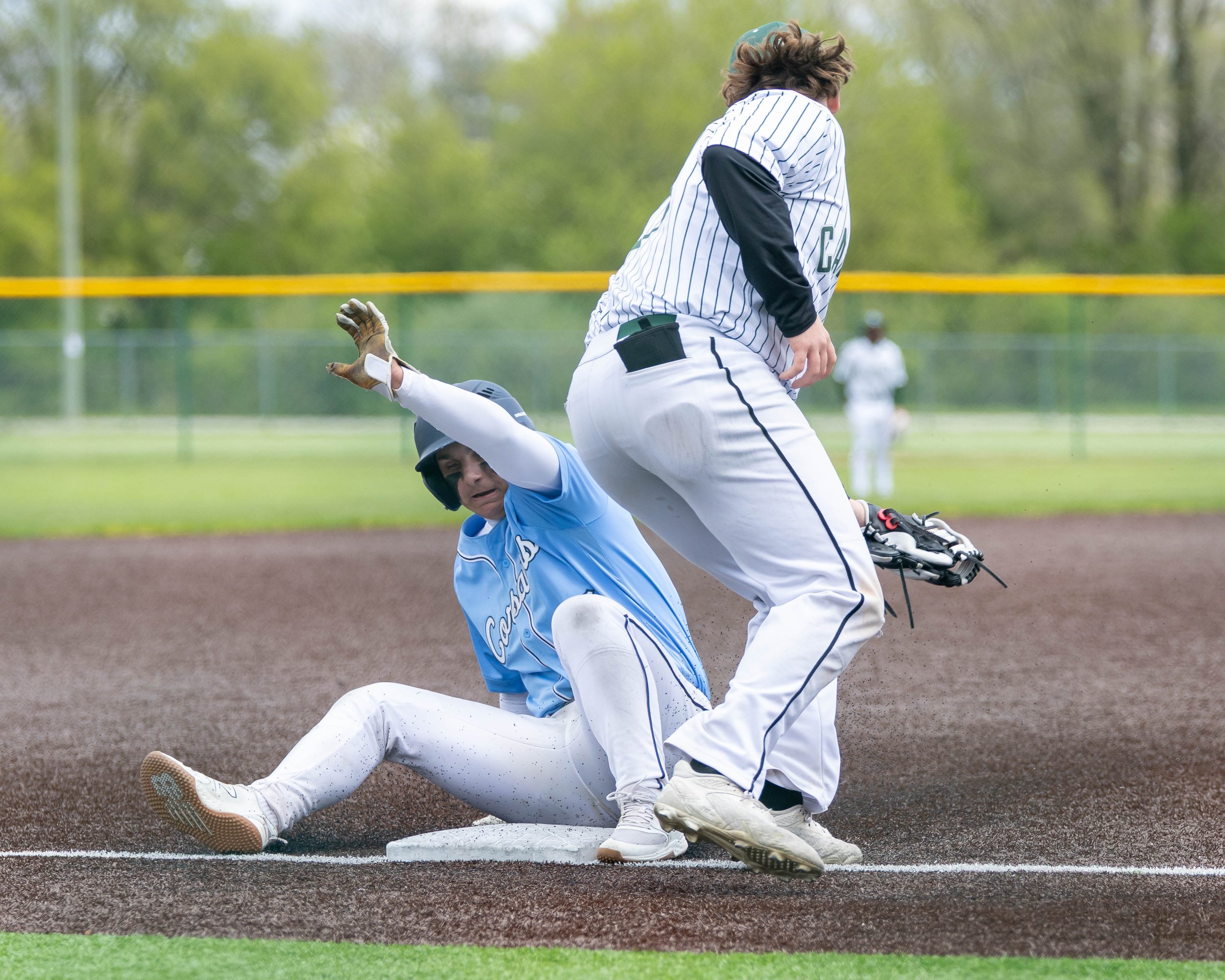 Mott player slides into 3rd base