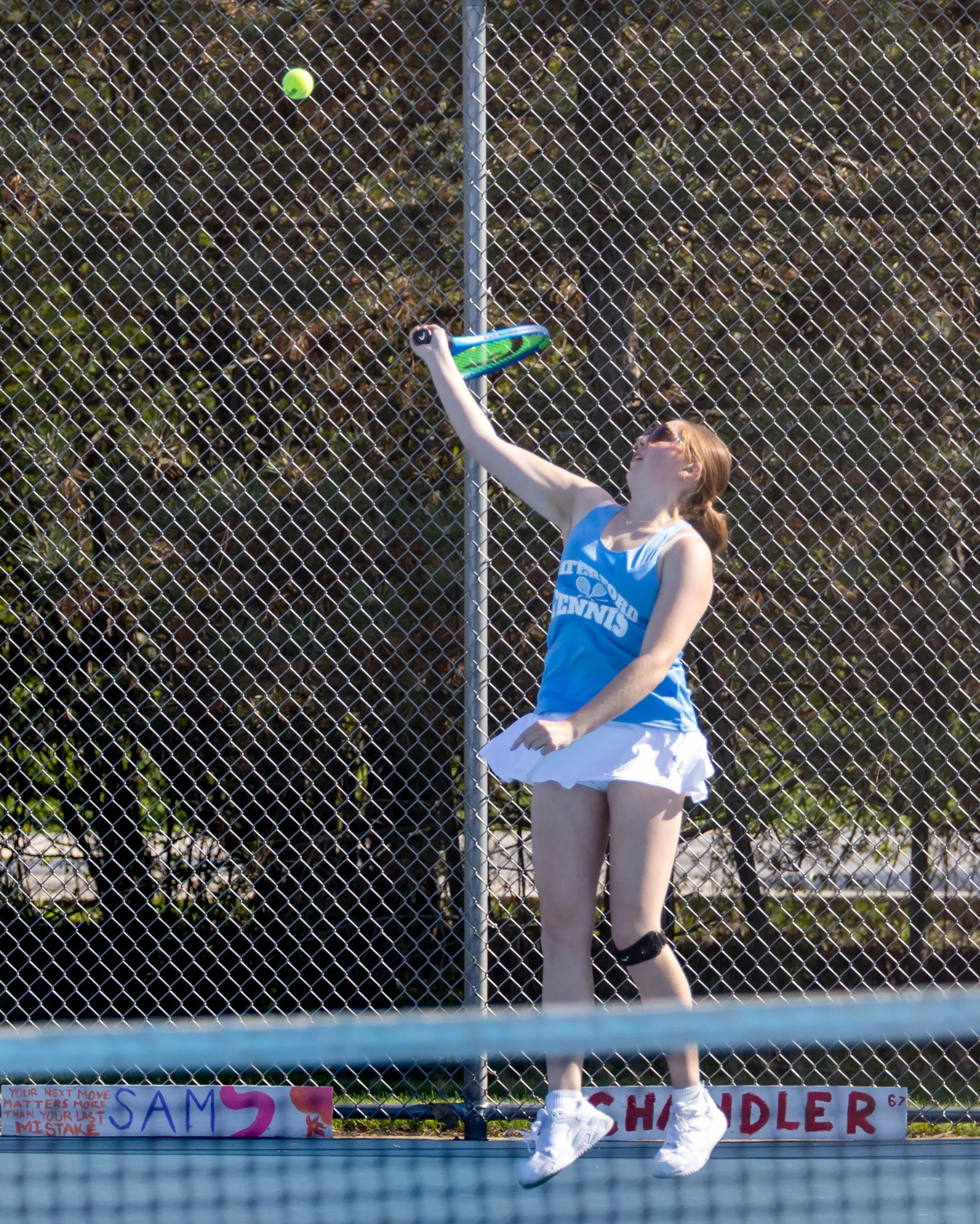 Waterford United player serves the ball