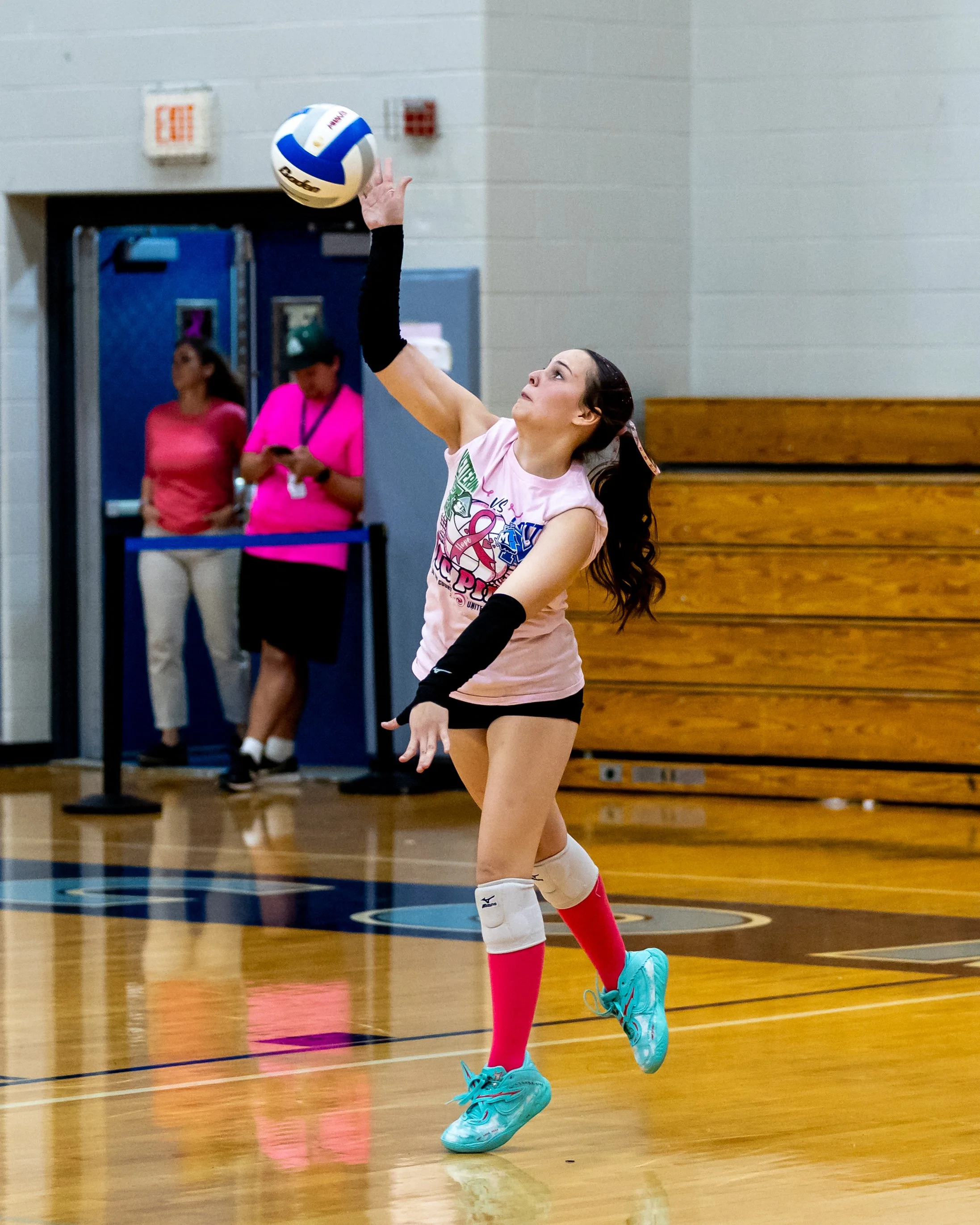 Mott player serves the ball