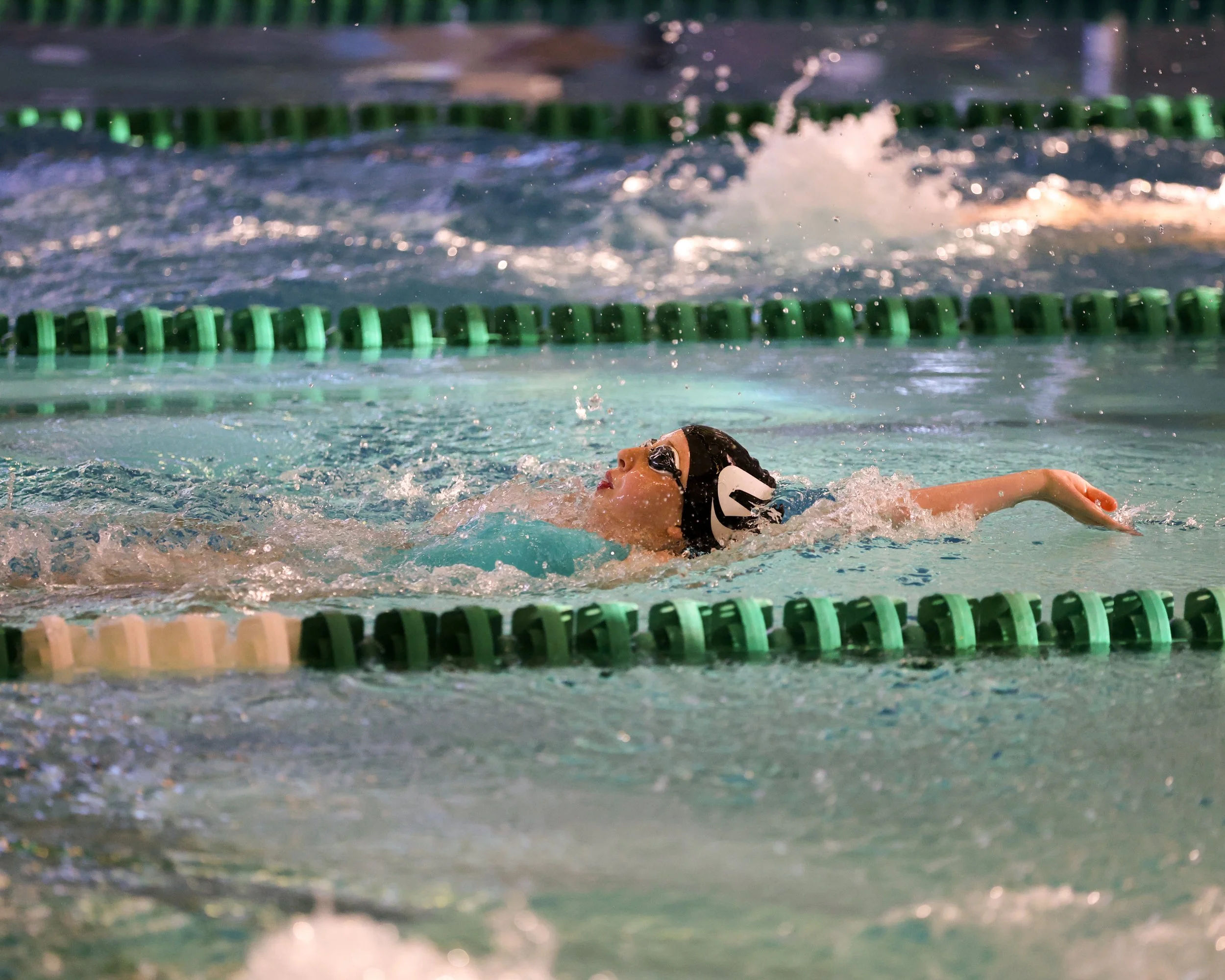 WU swimmer doing backstroke