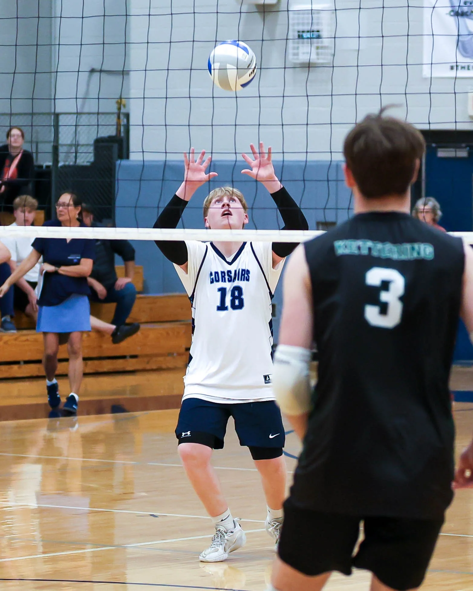 Mott #18 sets the ball