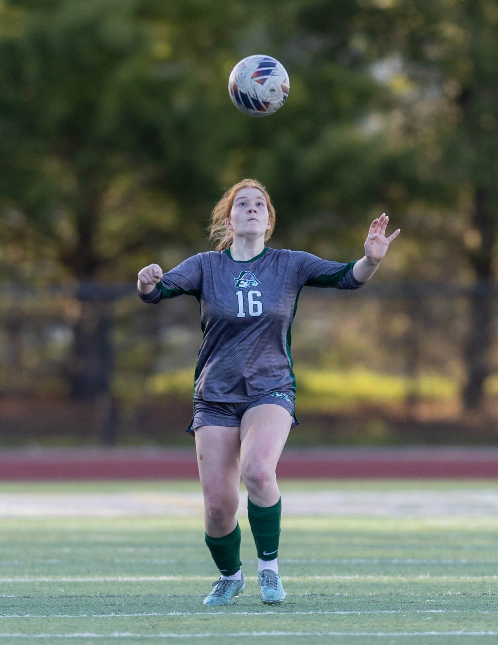 #16 about to head the ball