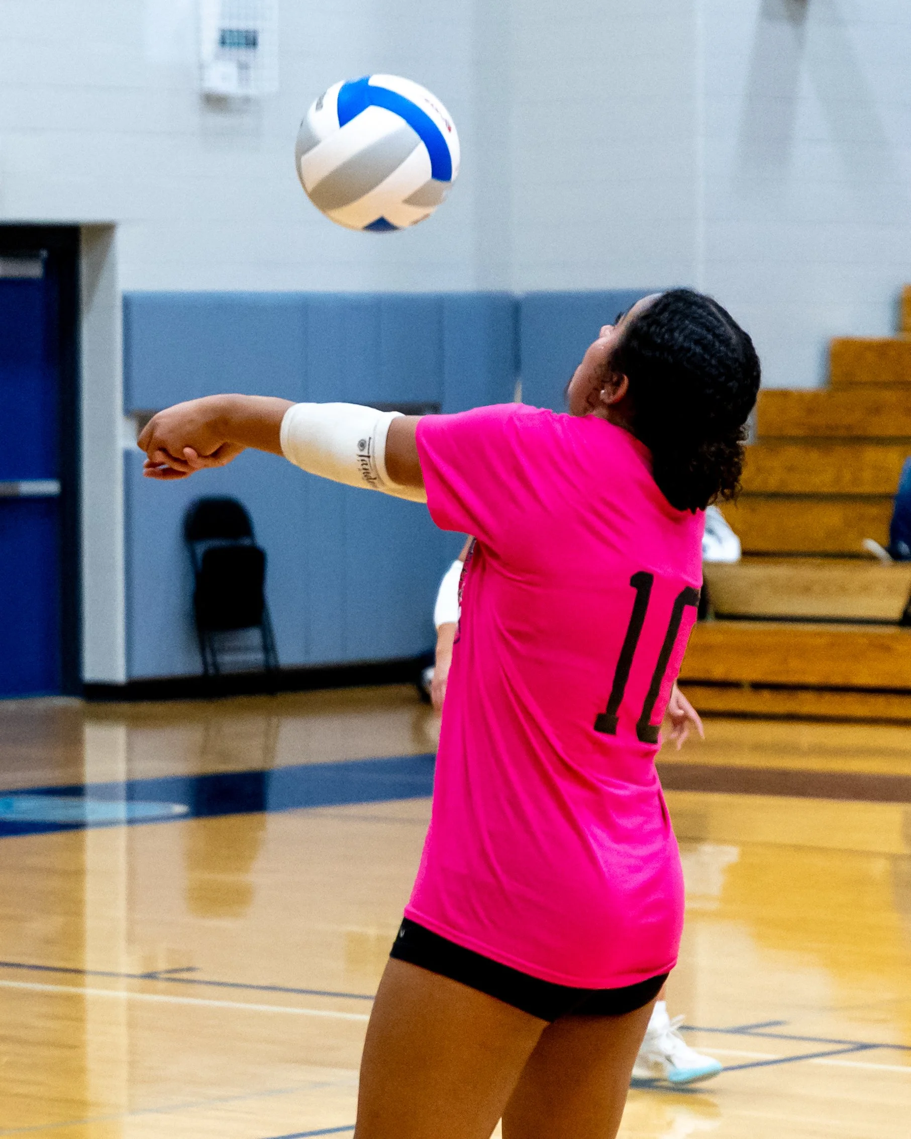 Kettering player hits the ball