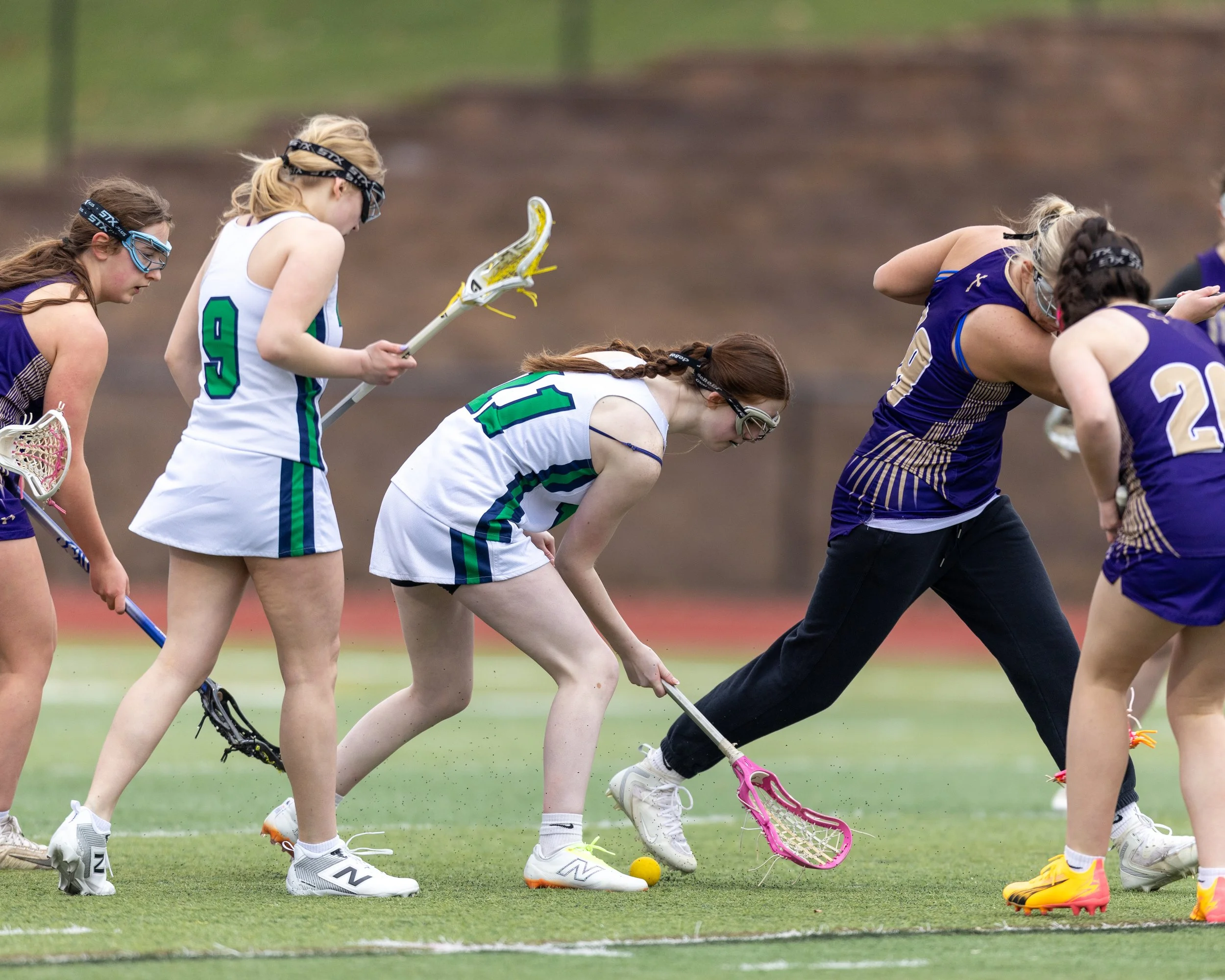 #11 tries to pick up the ball