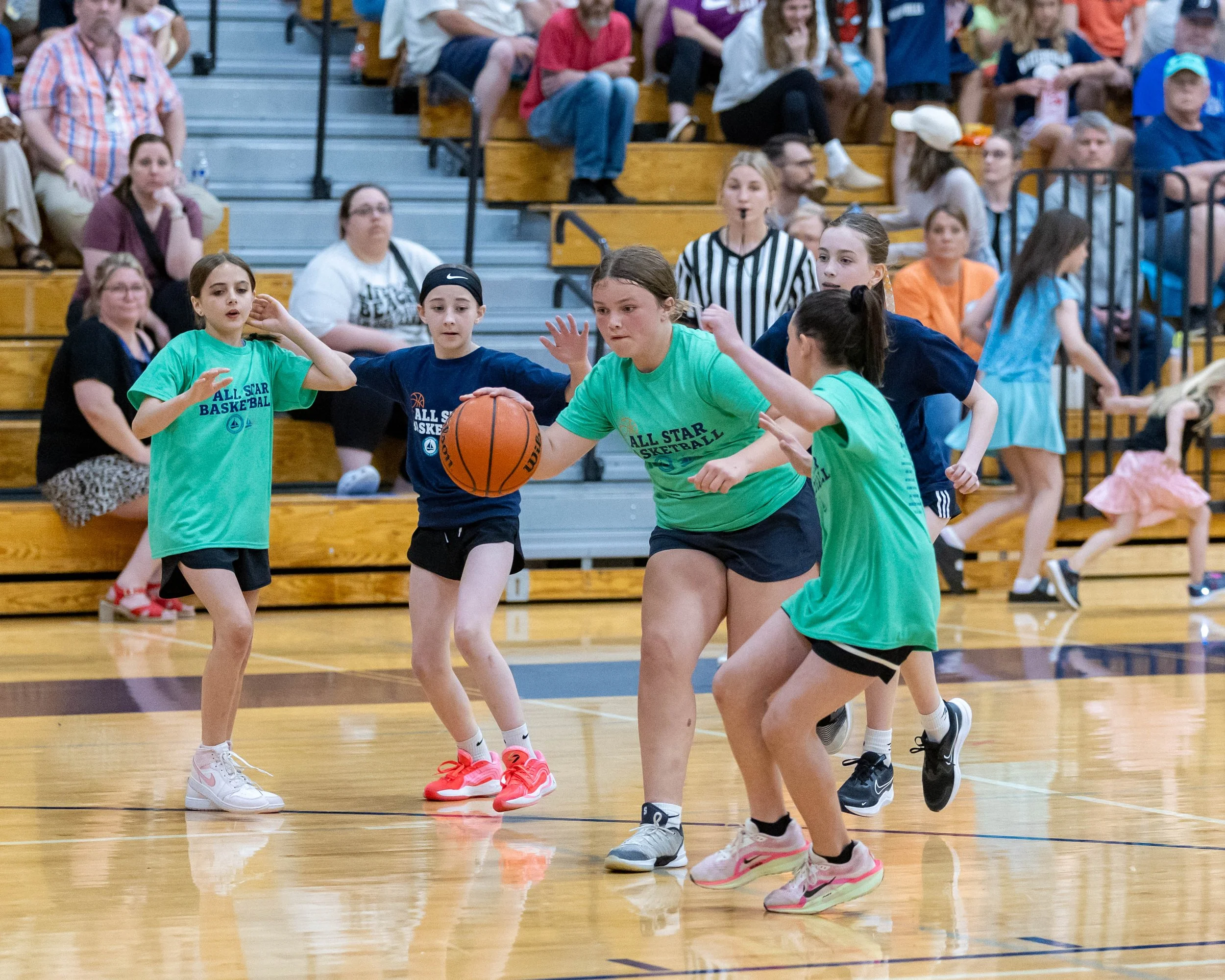 South girl dribbles the ball