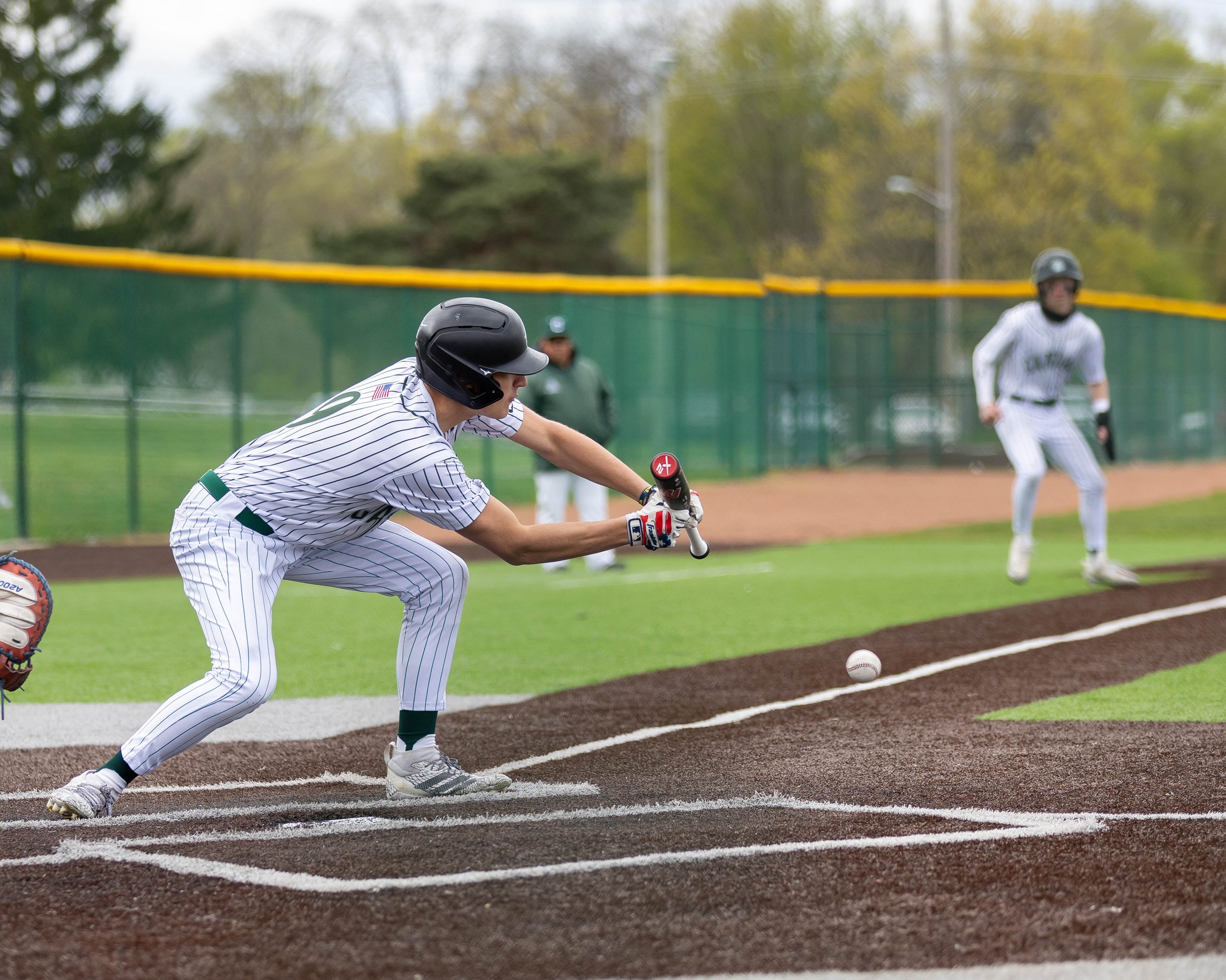 Kettering batter drops down a bunt foul