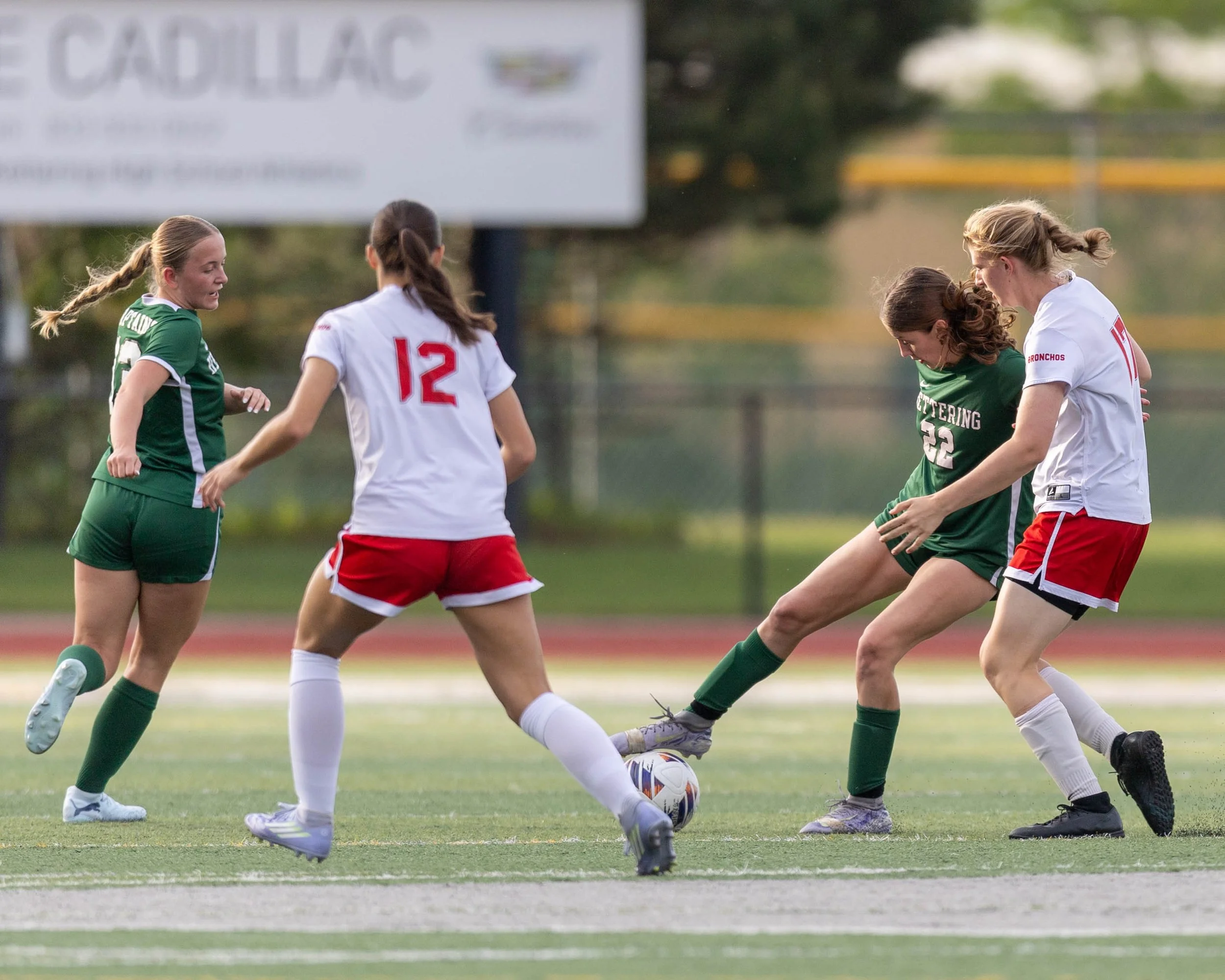 #23 stops the ball with her foot