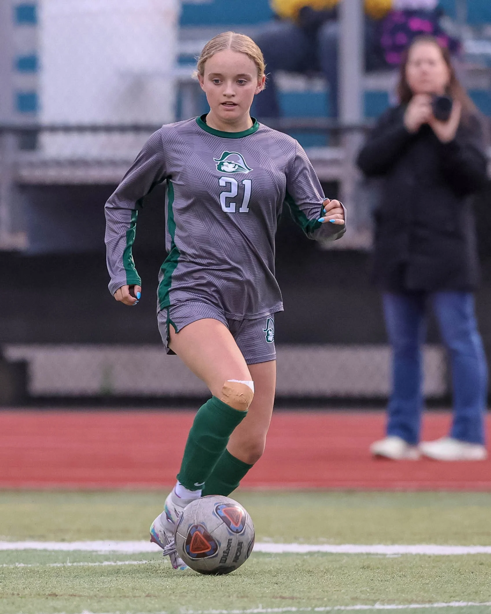 #21 dribbles the ball