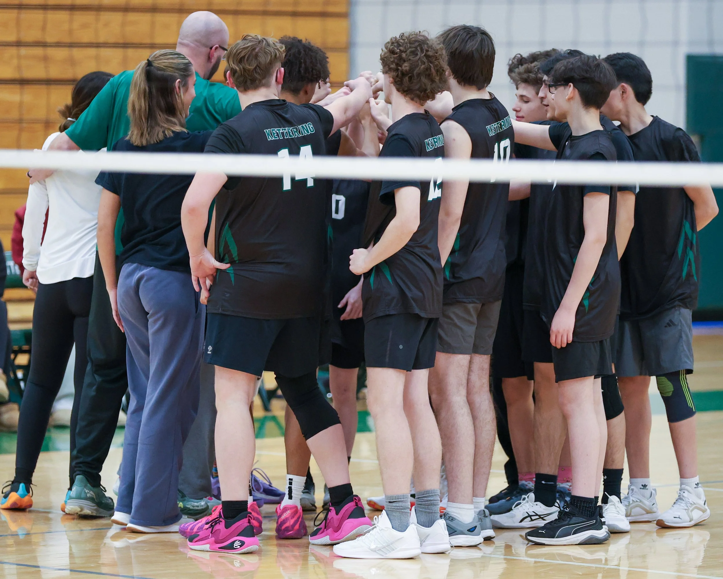 Team huddle with coaches