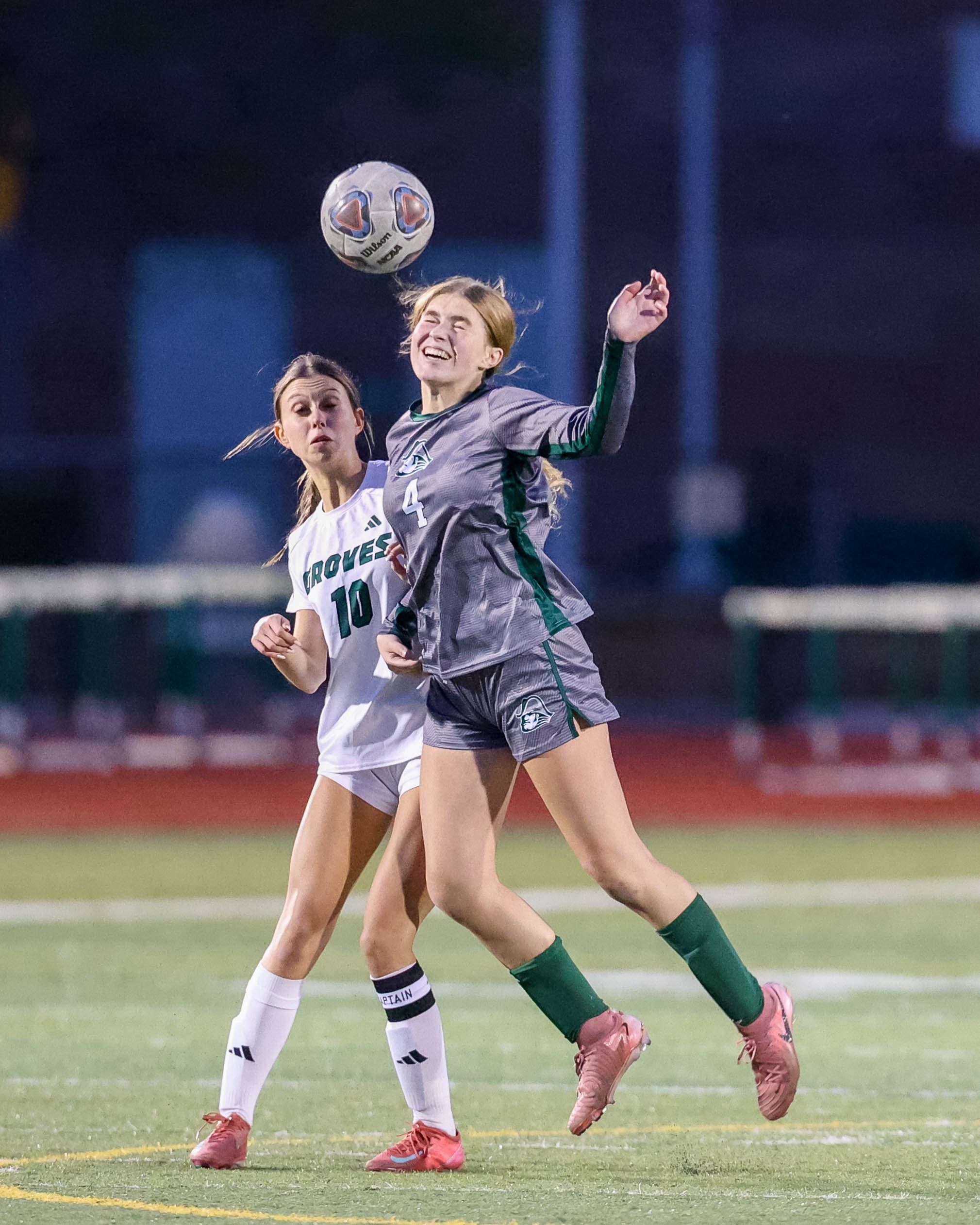 #4 heads the ball