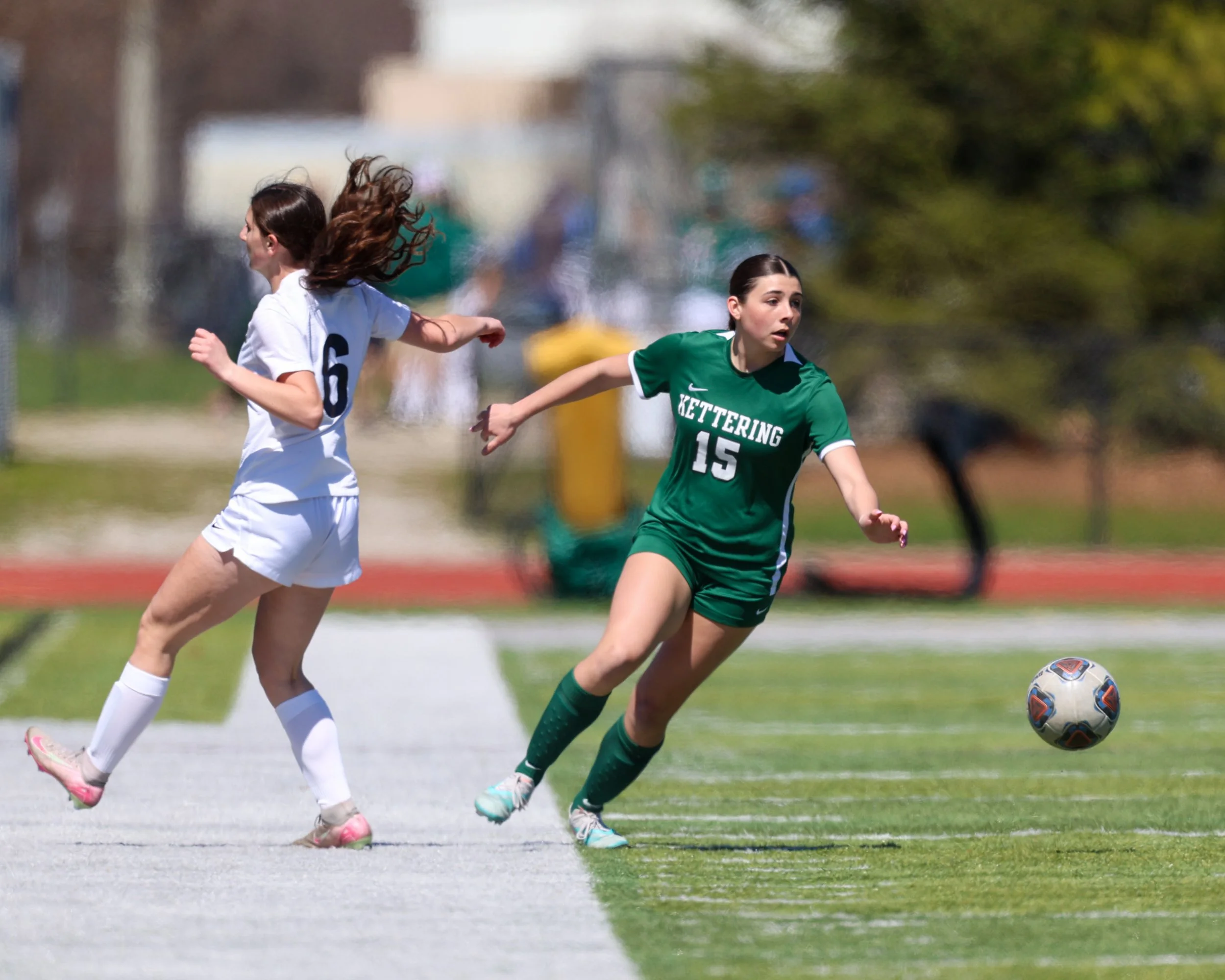 #15 looks to pass the ball