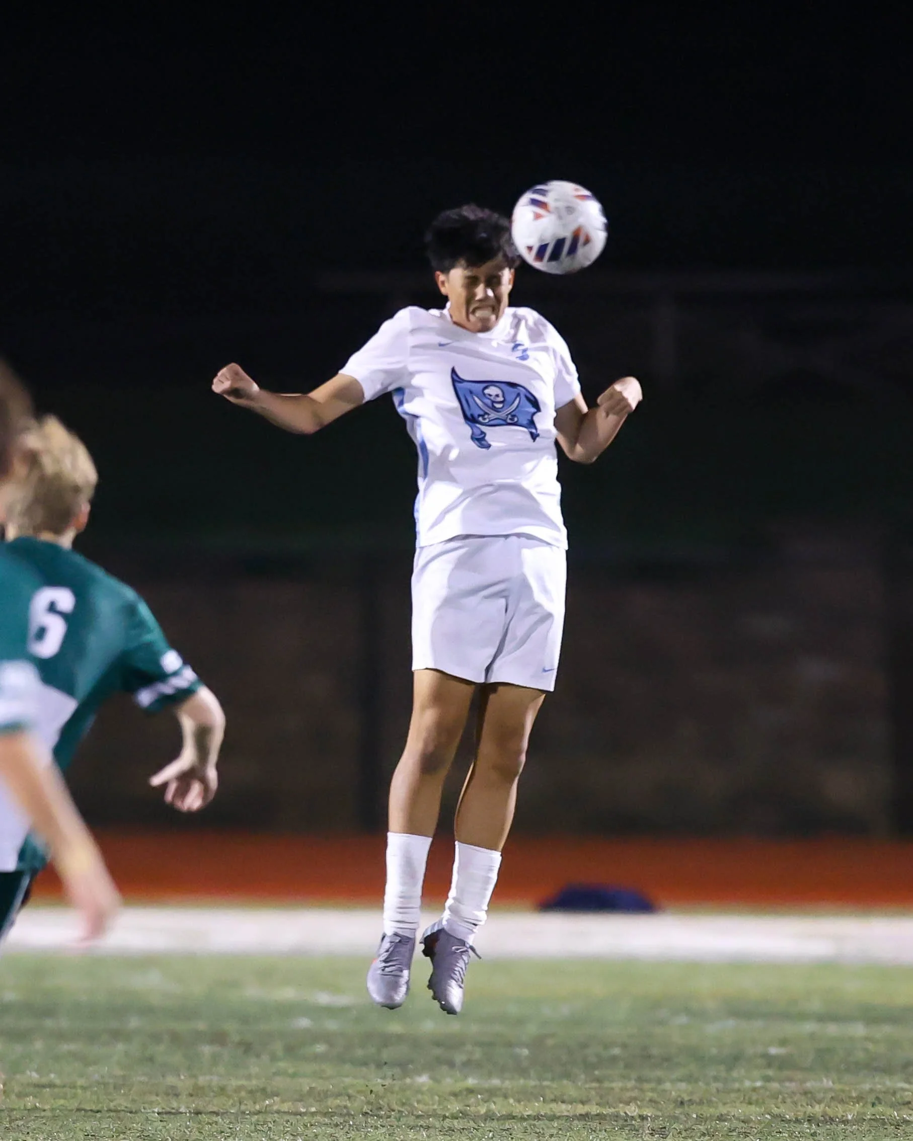 WM #6 heads the ball