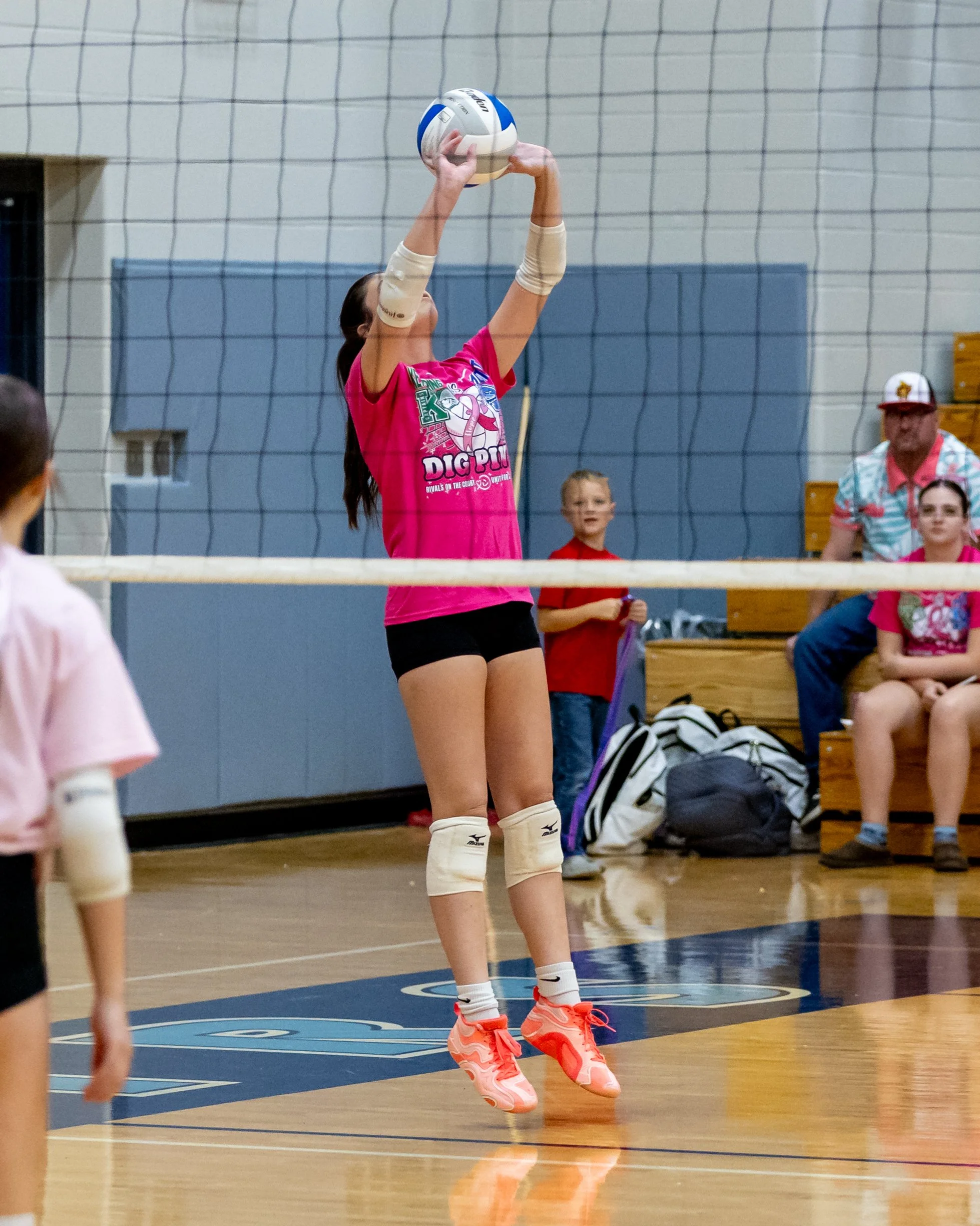 Kettering player hits the ball