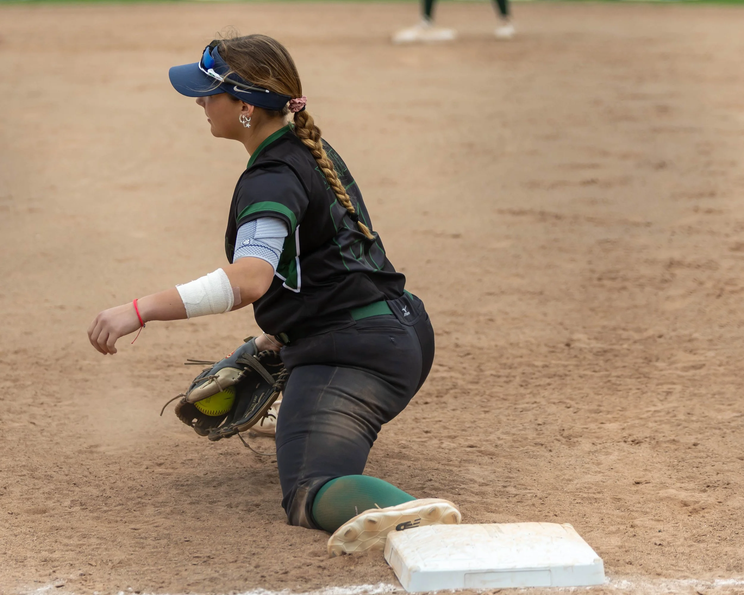 Kettering first base stretches for the ball