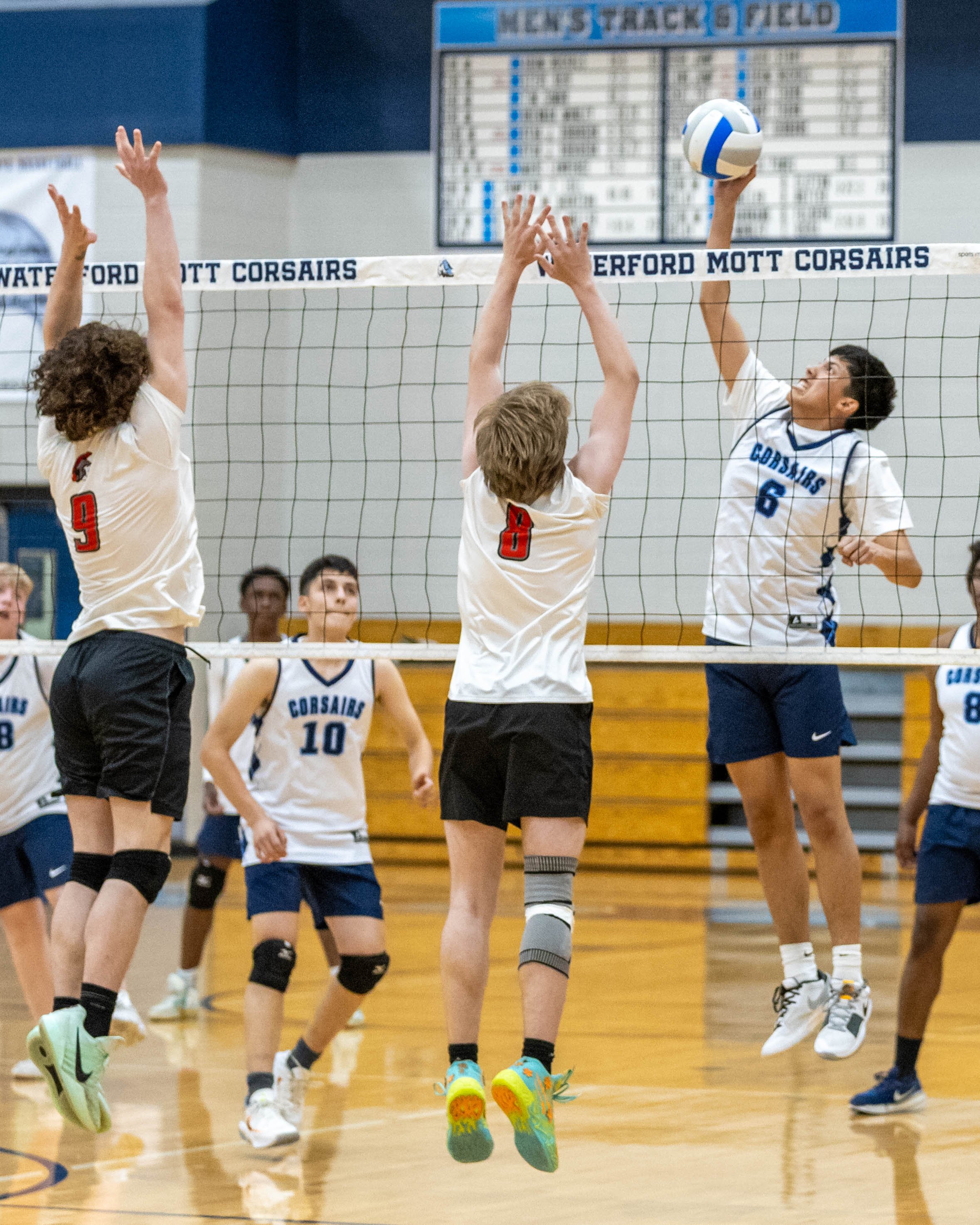 #6 spikes the ball