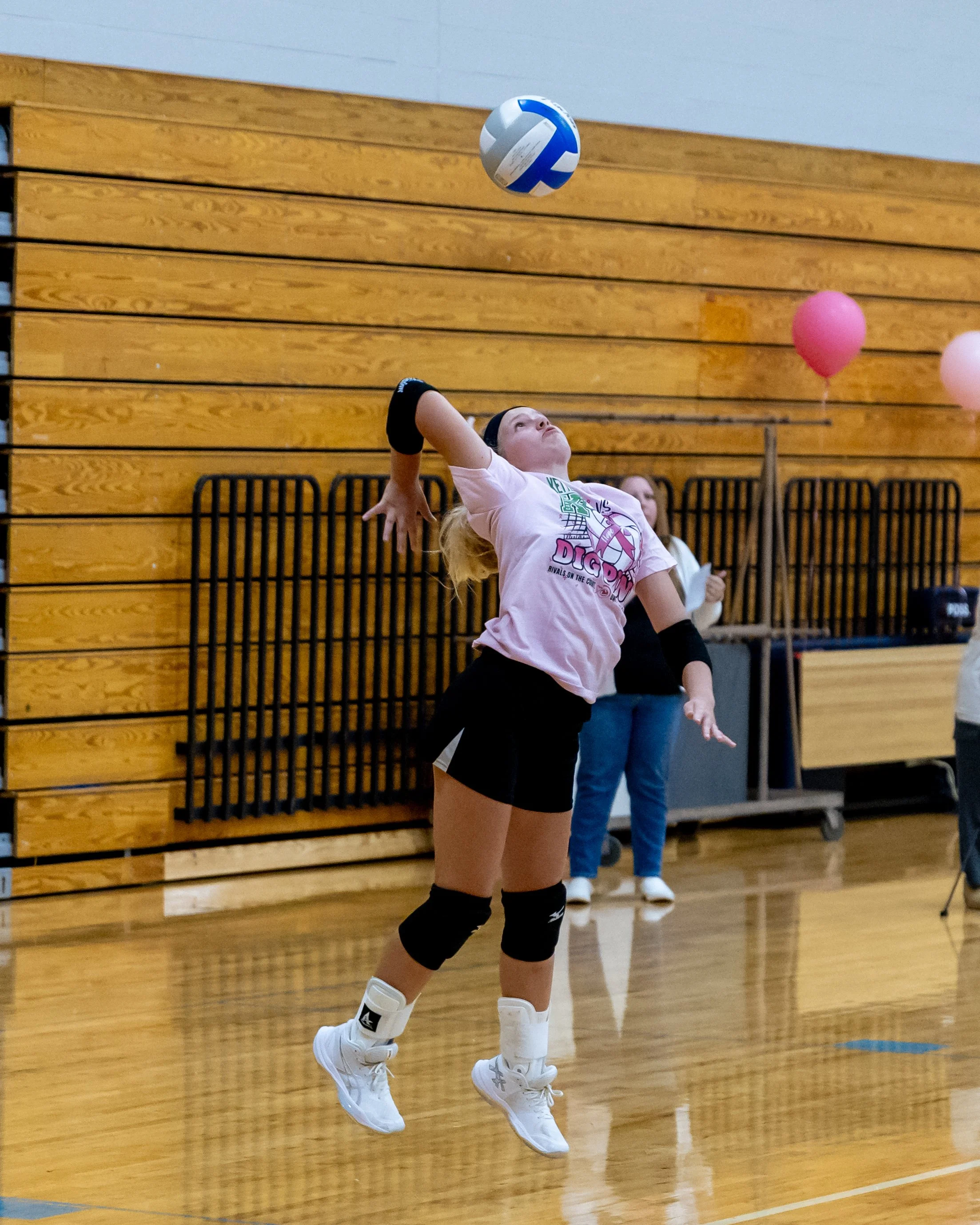 Firebird player serves the ball