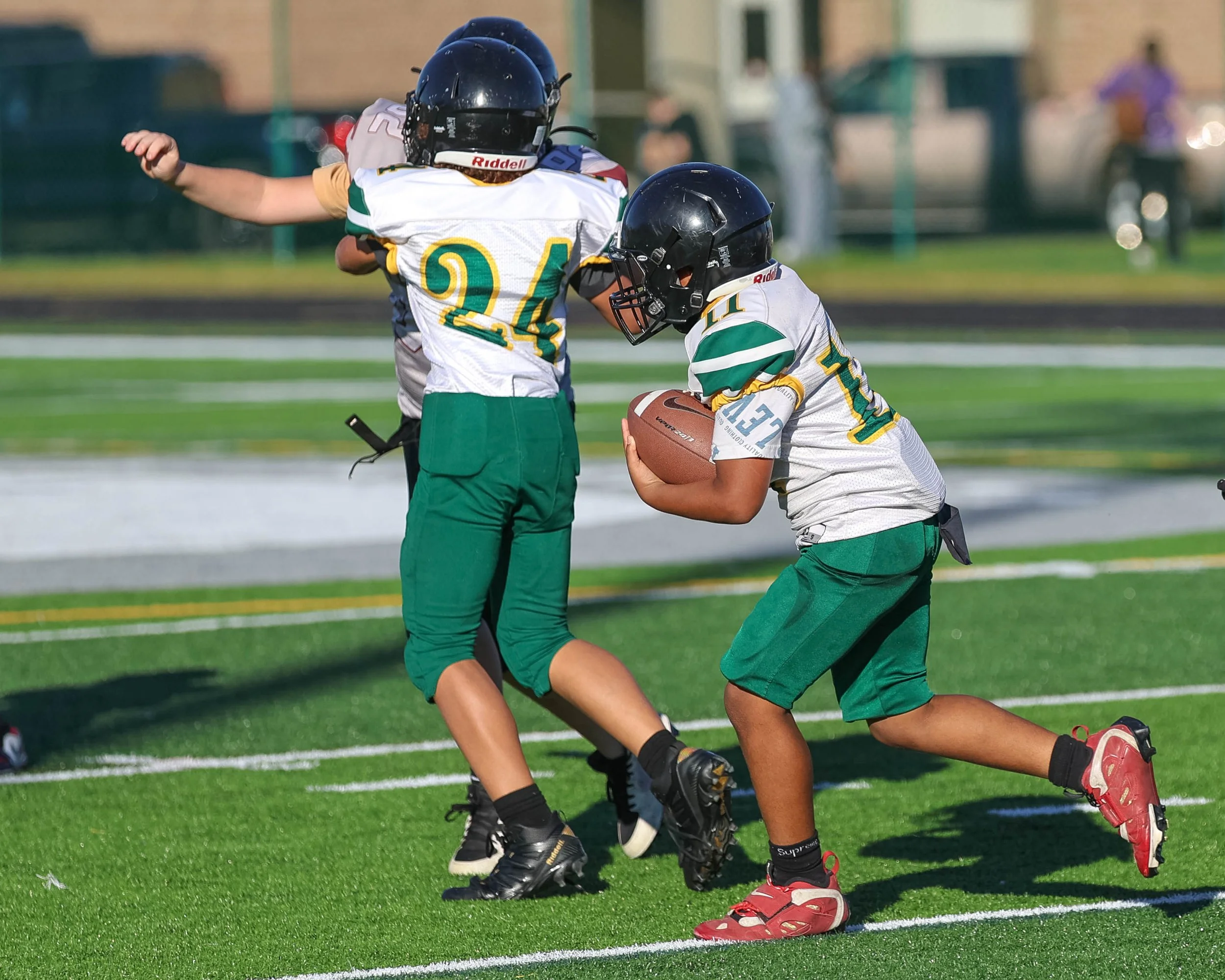 Pierce #11 moves the ball with a block by Pierce #24