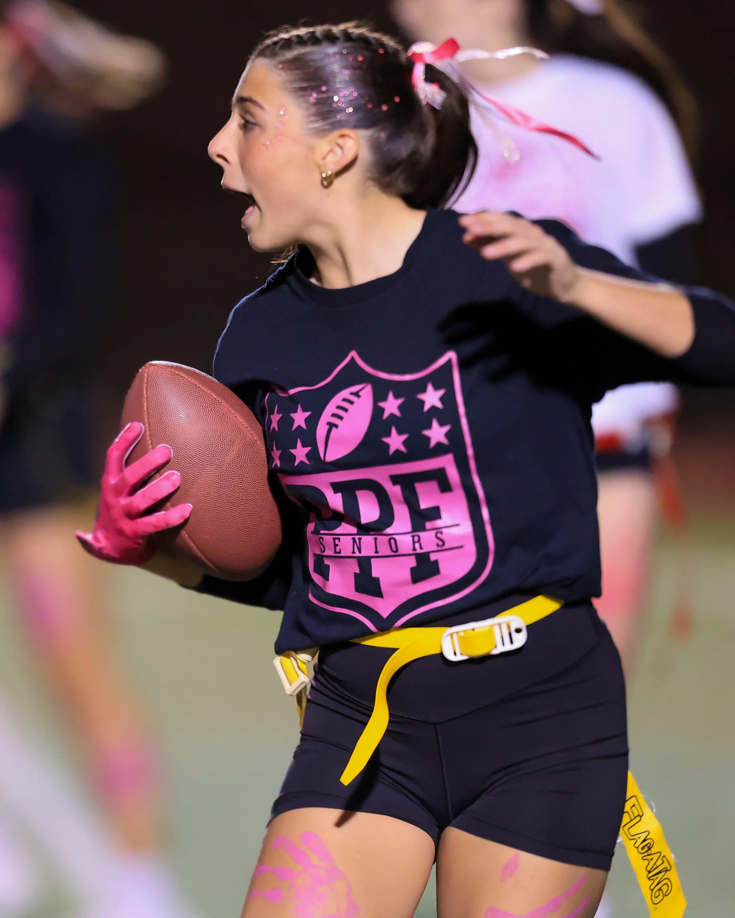 Senior running with the ball