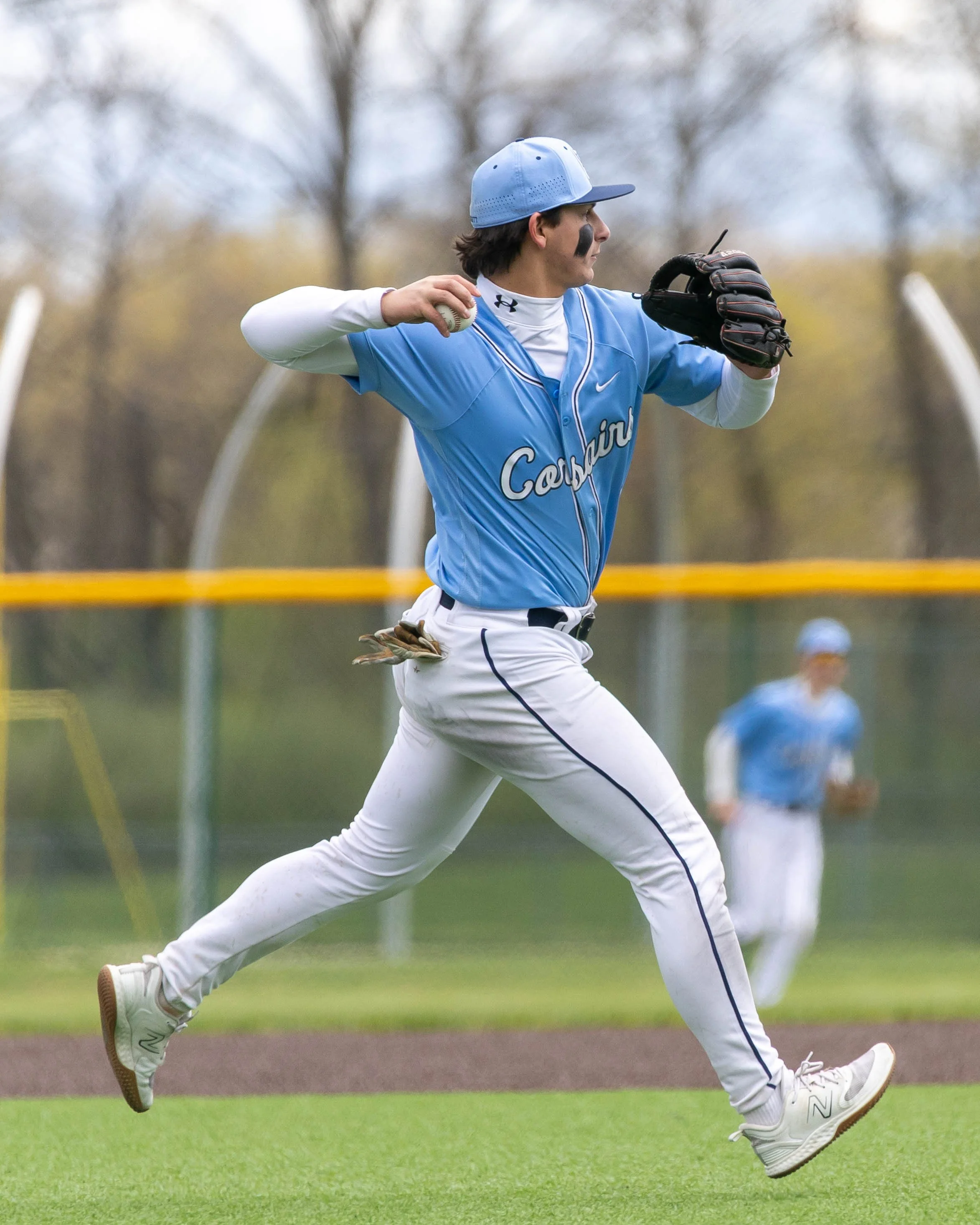 Mott #5 winds up to throw to 1st base
