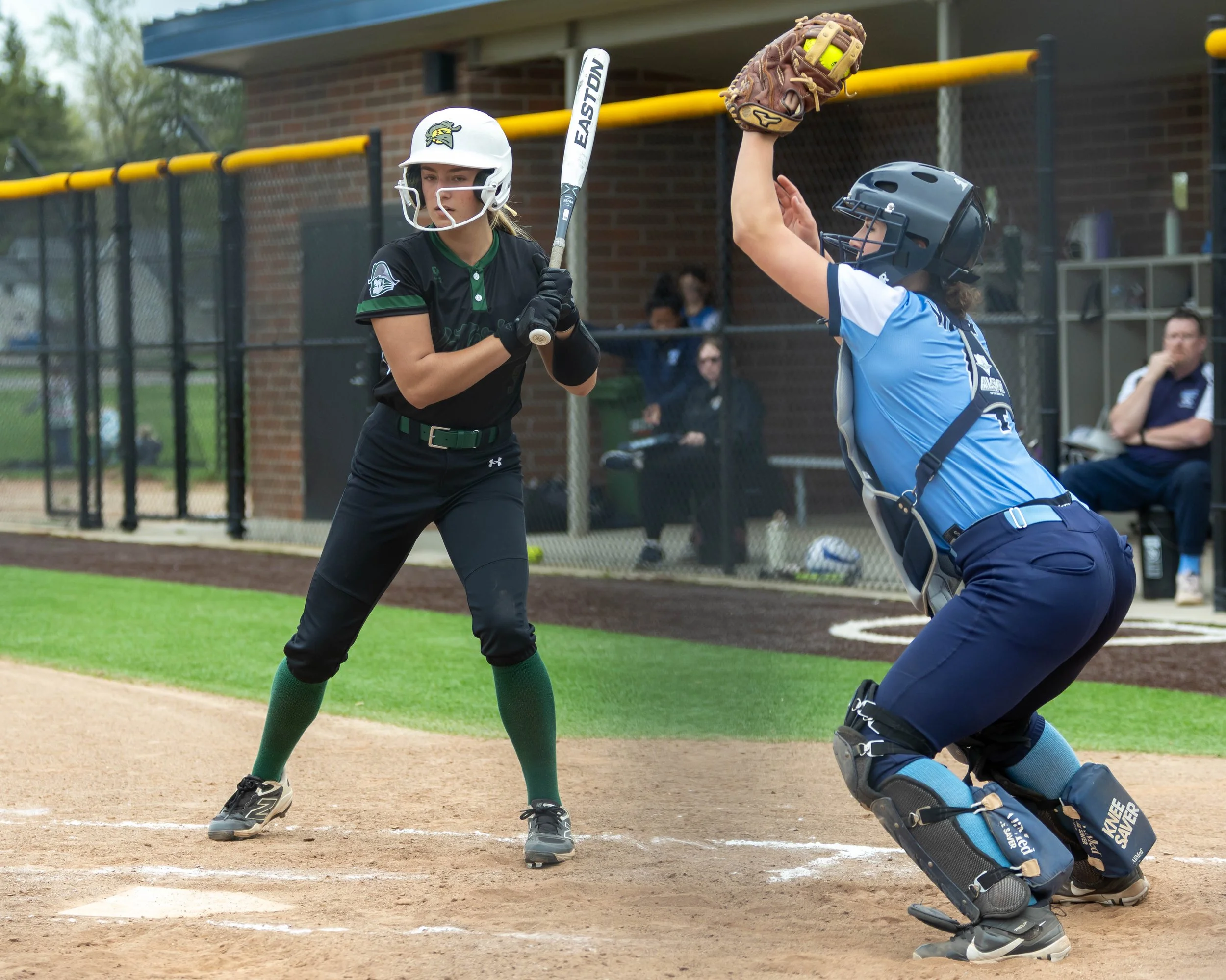 Kettering batter takes a high ball caught by the Mott catcher