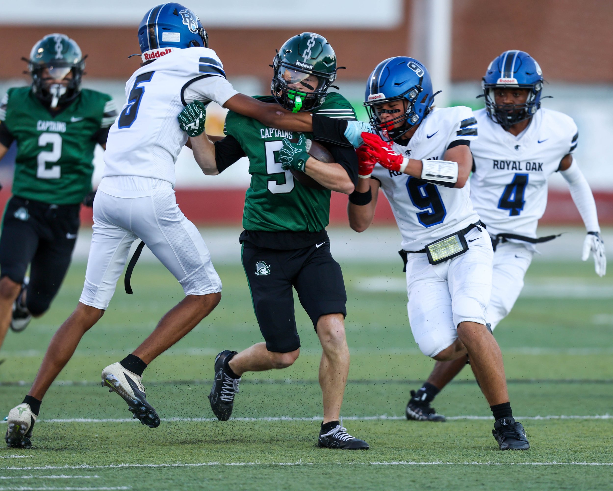 WK #5 fights through a tackle
