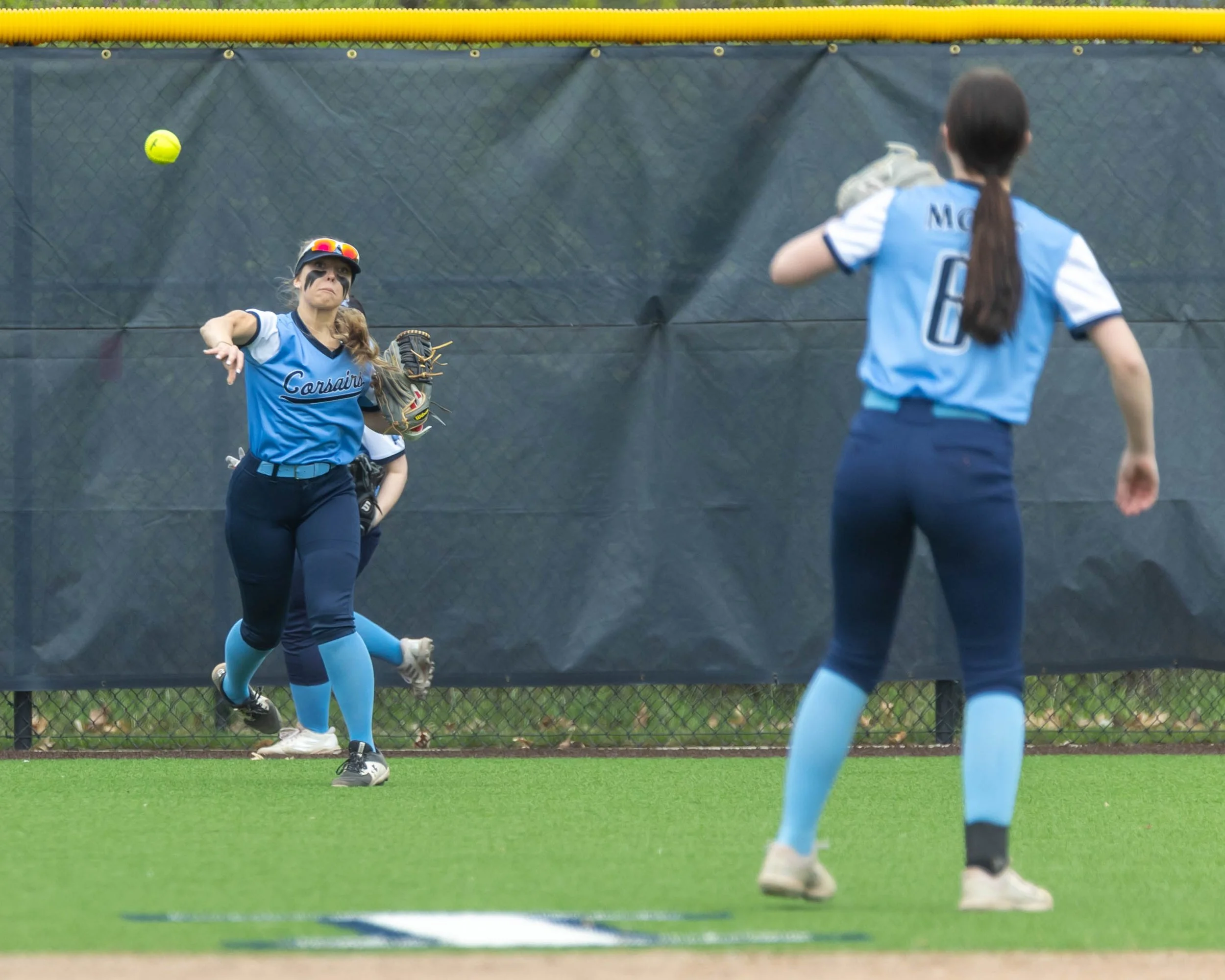 Mott centerfielder throws the ball to the cutoff 